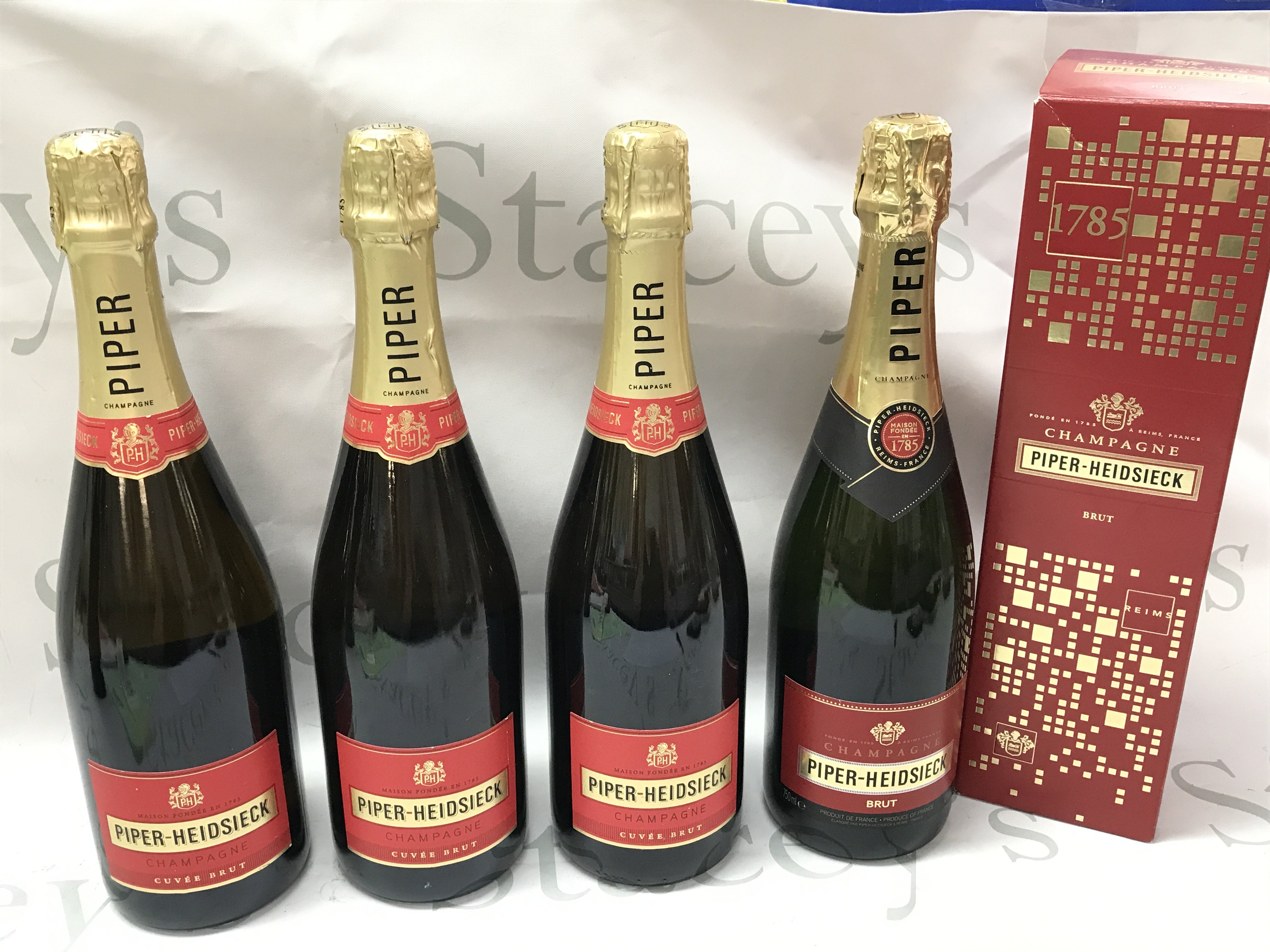 Four bottles of Piper Heidsieck Champagne , one boxed. This lot cannot be posted