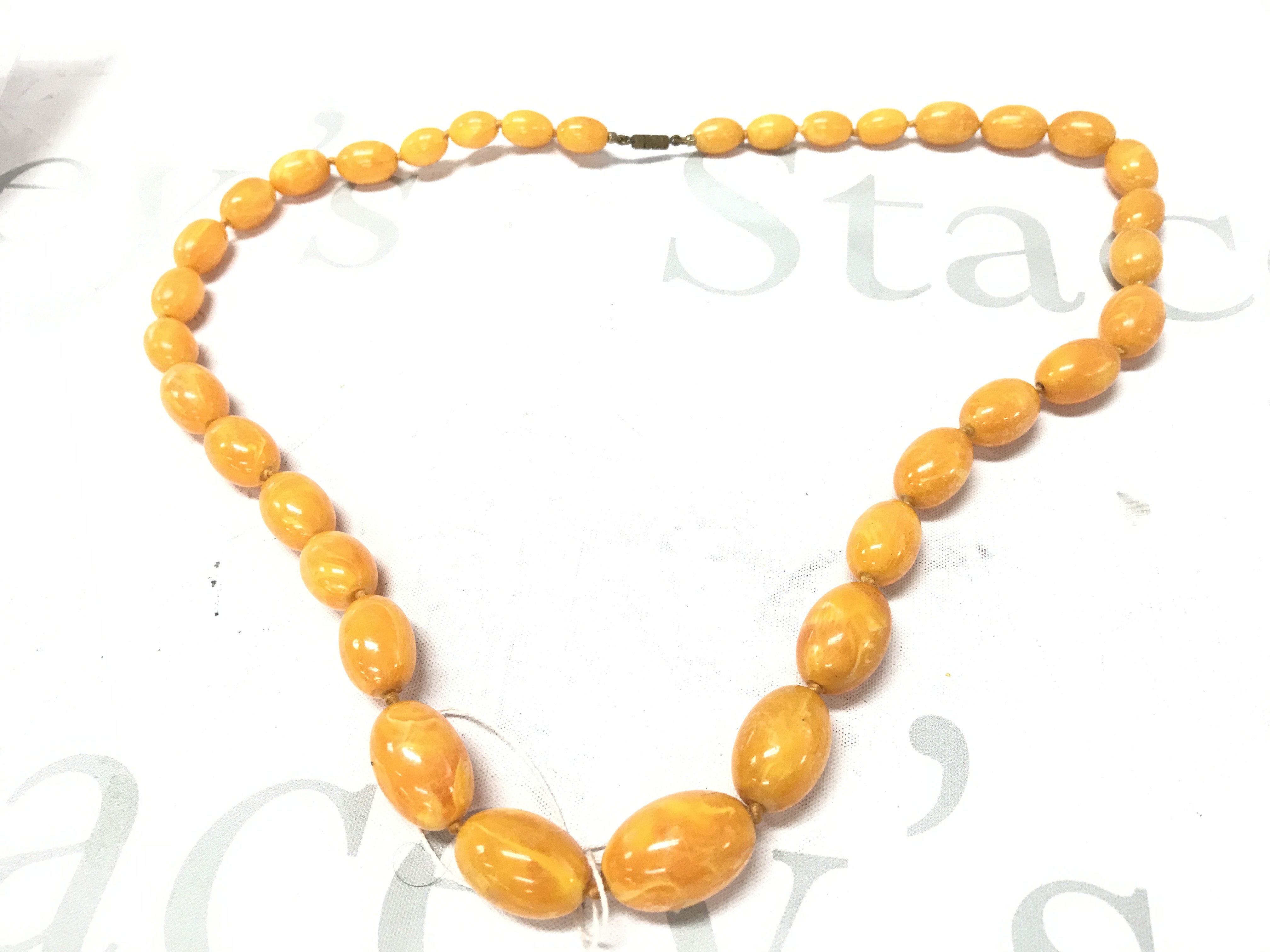 Butterscotch amber necklace , 65g 73cm. Postage category A