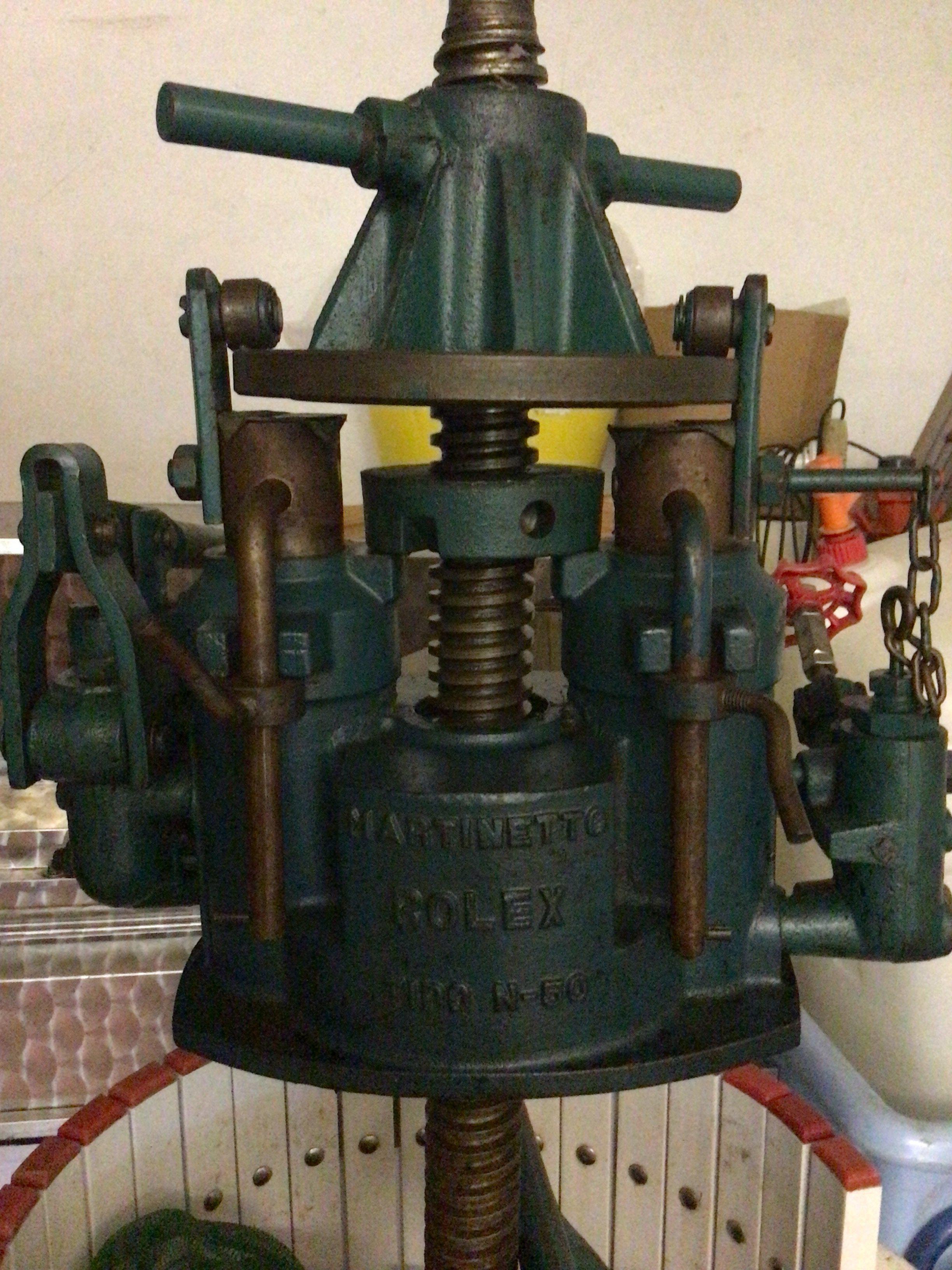 A large Martinetto Rolex Tipo N-50 grape press on a trolley with wheels