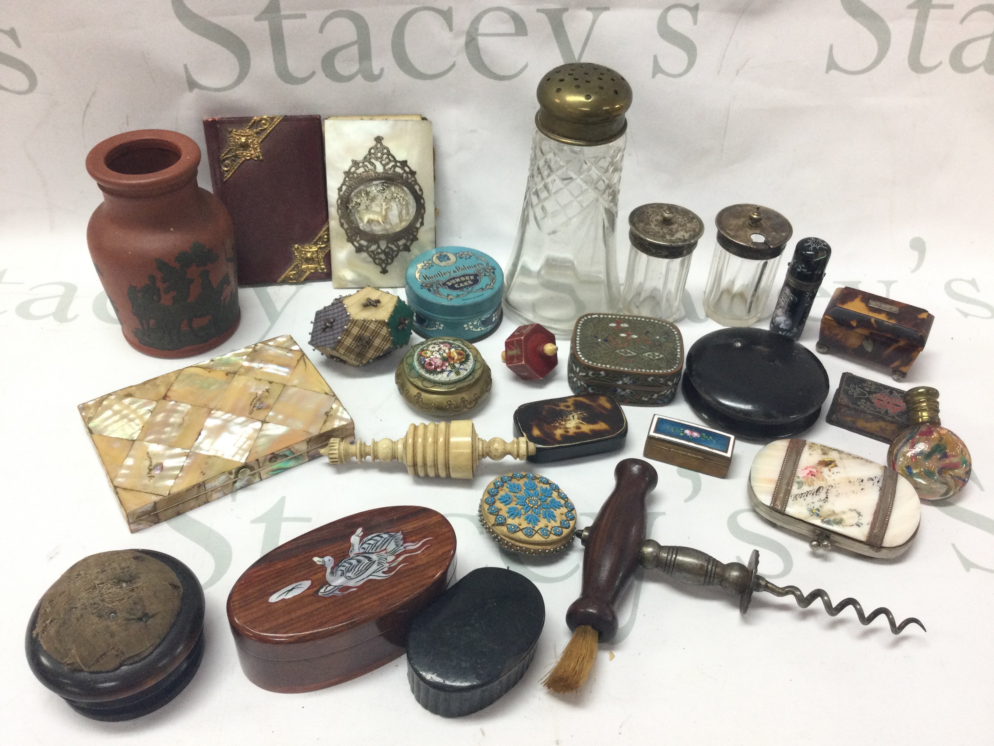 A collection of items including a mother of pearl case, terracotta Victorian vase with decorated hunting scene, tortoiseshell boxes, vintage enamel decorated trinket box. This lot cannot be posted
