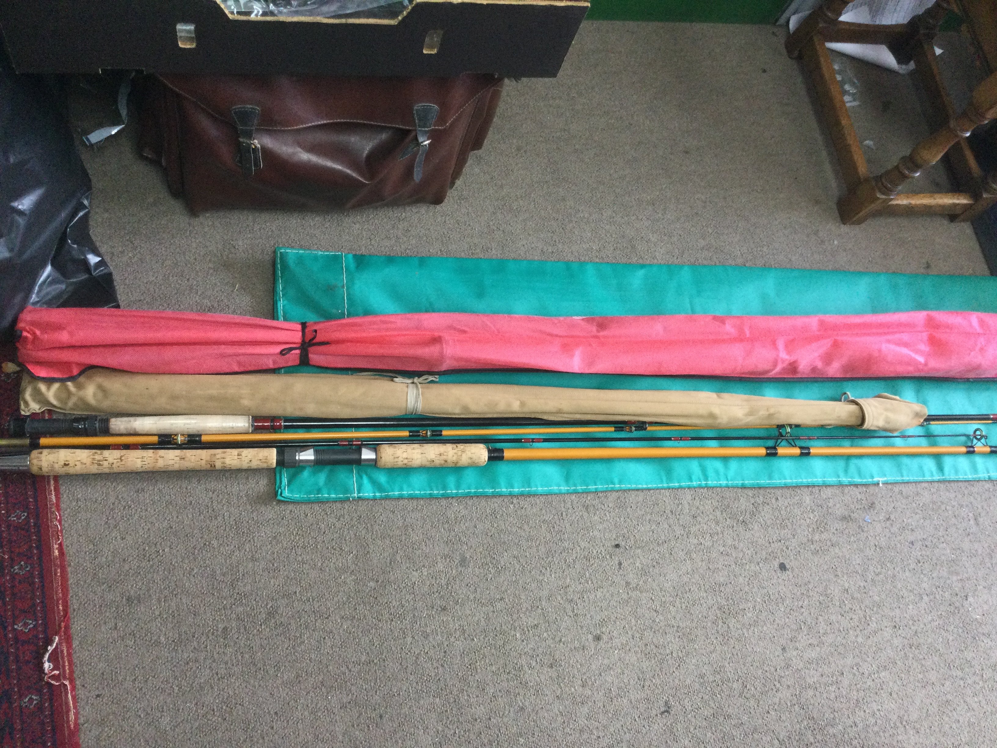 A collection of vintage fishing equipment including rods. Shipping category D.- NO RESERVE