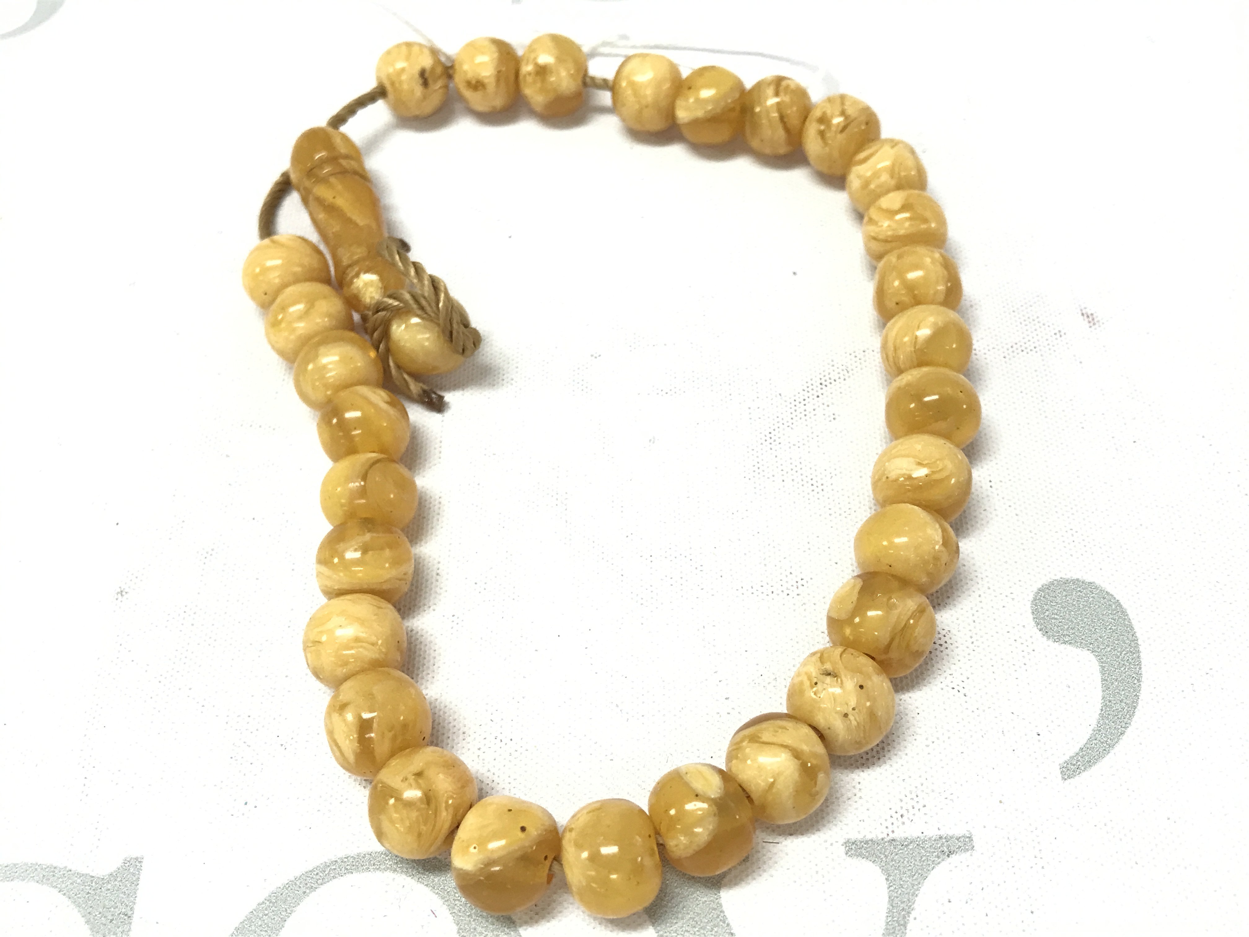 Prayers Bakelite amber style necklace . Postage category A