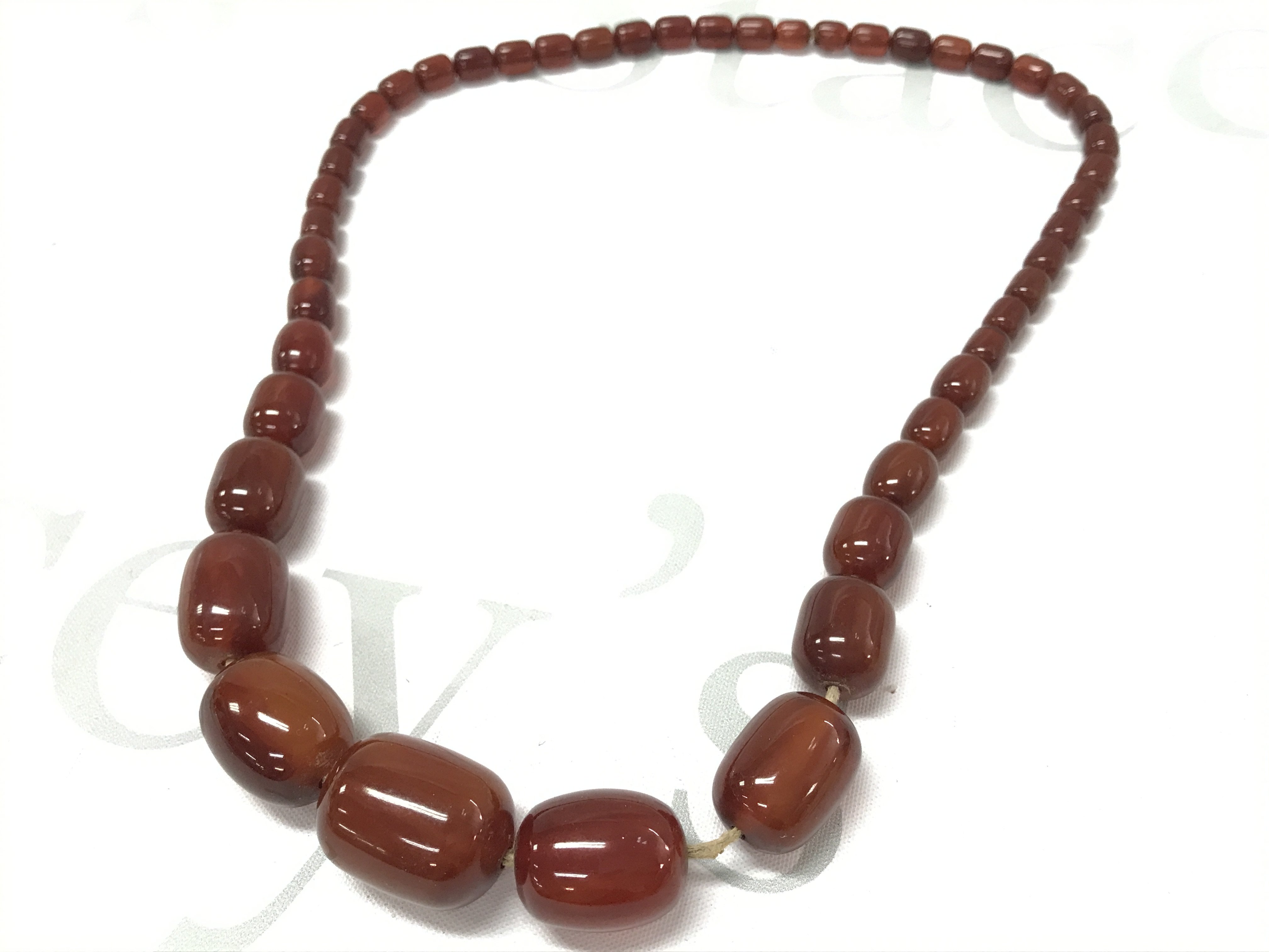 Genuine Bakelite cherry amber colour necklace . 65g 60cm Postage category A