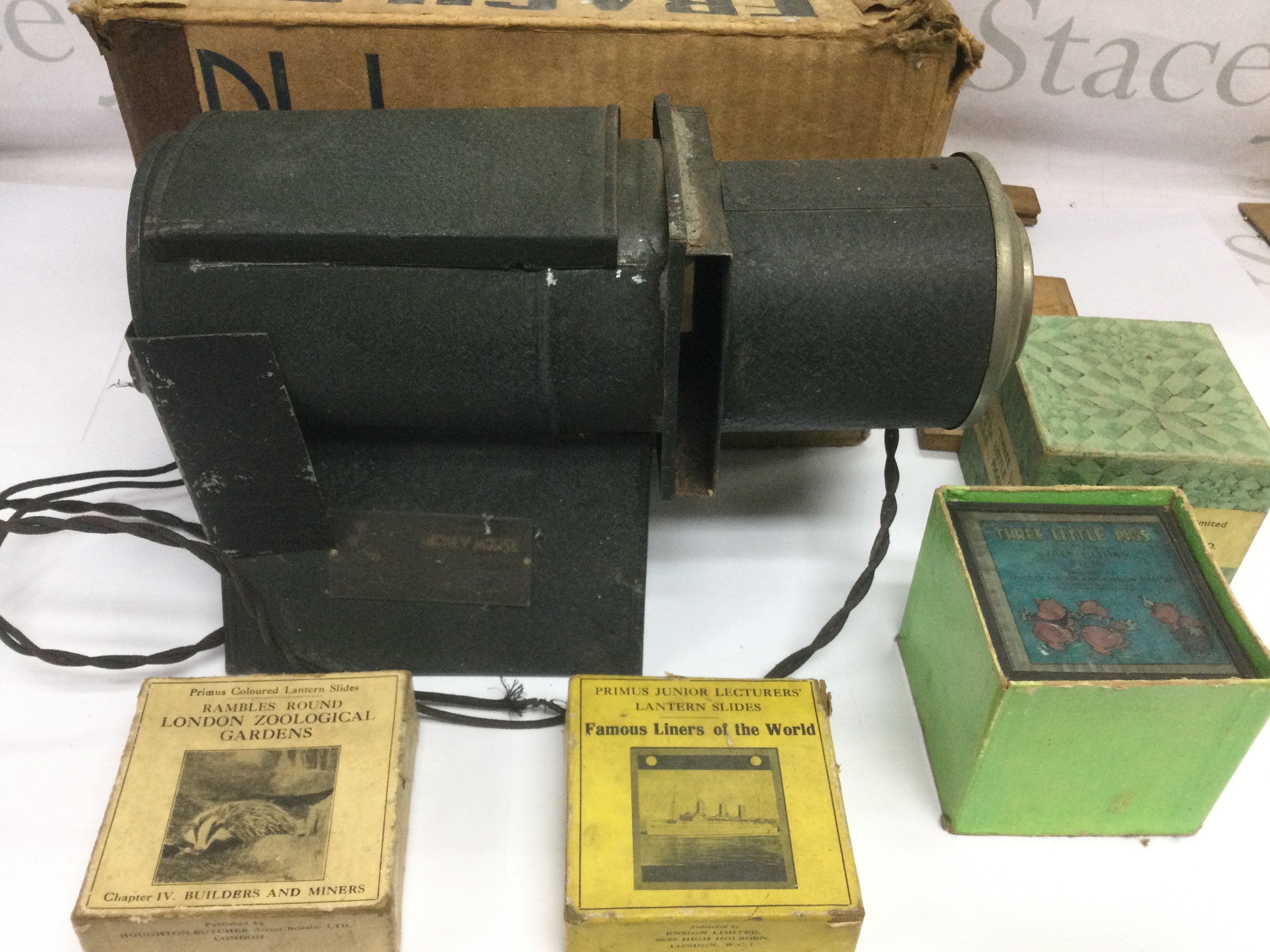 A Mickey Mouse magic lantern and various slides. Shipping category D.