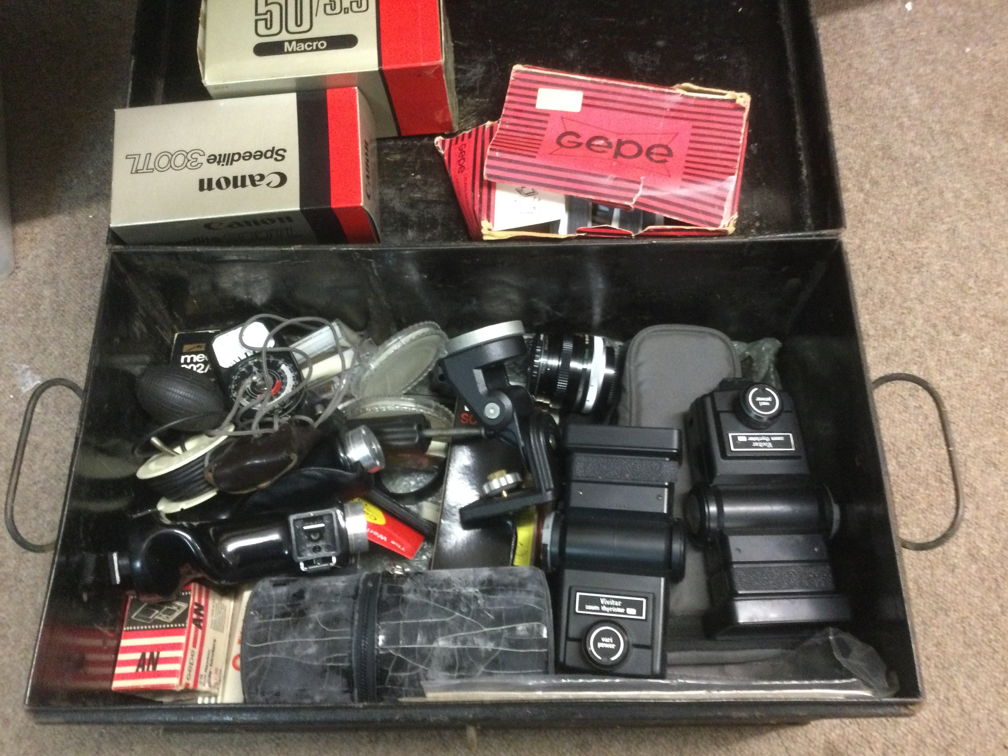 A tin containing a collection of vintage cameras. Shipping category D.