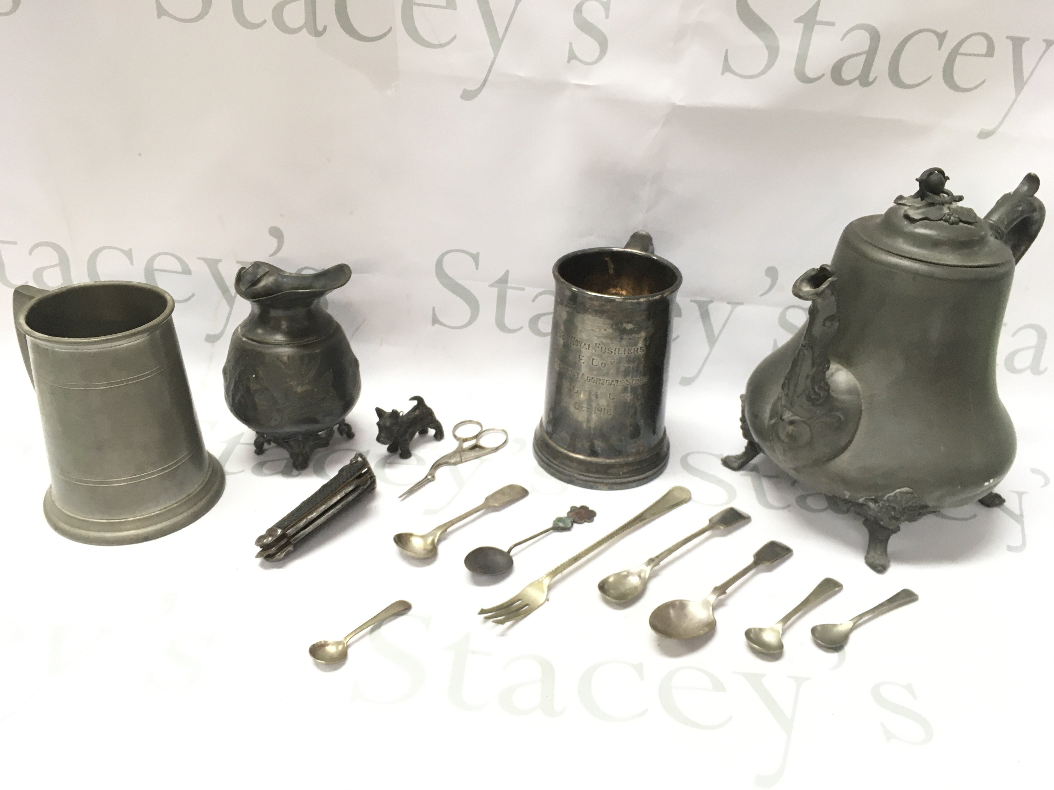 Silver plated and pewter items including a 52nd Royal fusiliers glass bottom military tankard, cast metal Scottish dog, Chinese spoon with jade insert, heron design sewing scissors, seamans rigging knife Etc. Postage category C