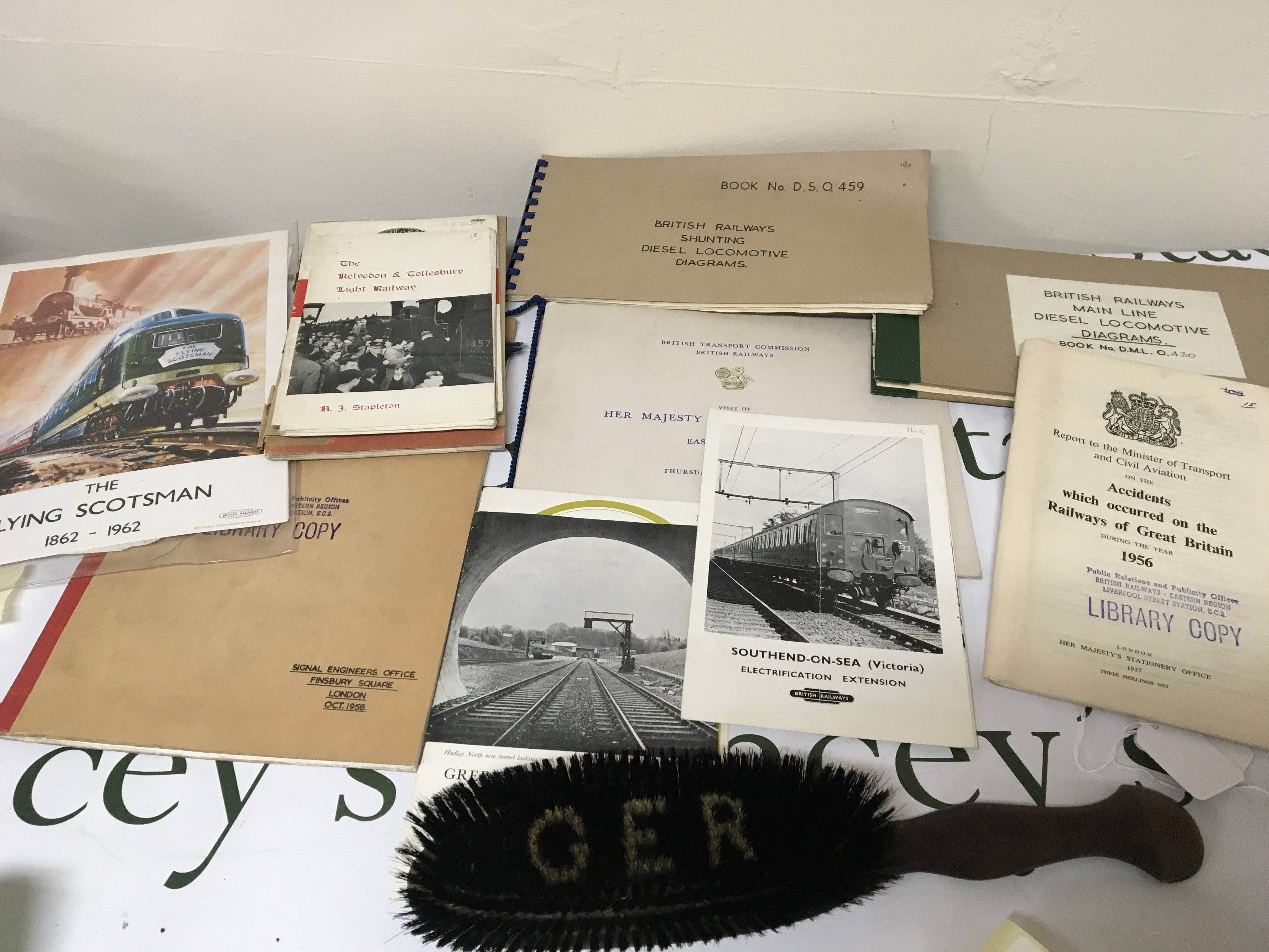 A collection of Railway Memorabilia including a GER brush used by senior station masters A Royal 1962 Eastern Region Broucher other books and ephemera.