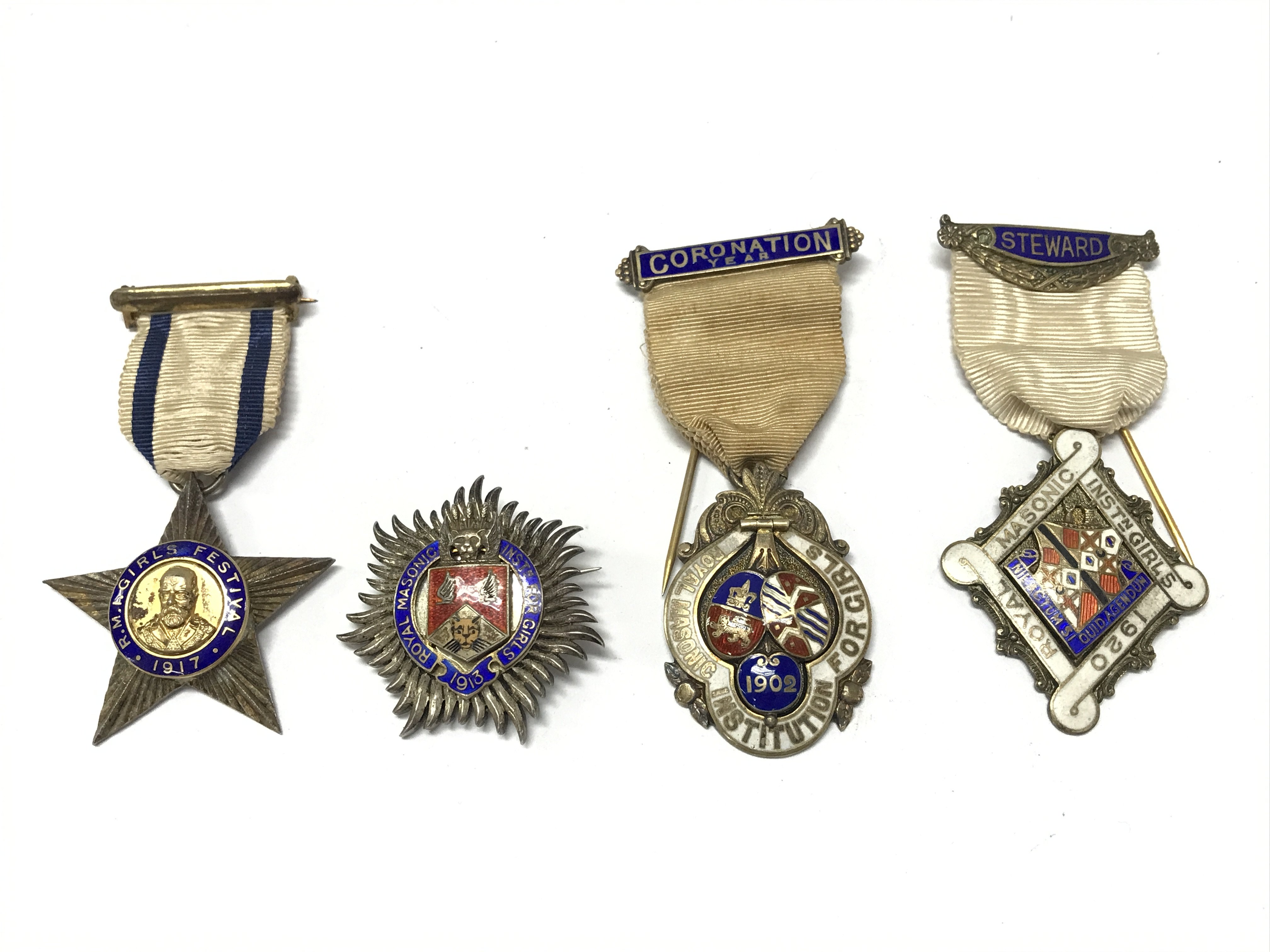 Four early 20th century silver and enamel Masonic stewards jewels including 1902 Edward VII coronation a quantity silver and enamel badge 1913 and two others dated 1917 & 1920. Postage category A