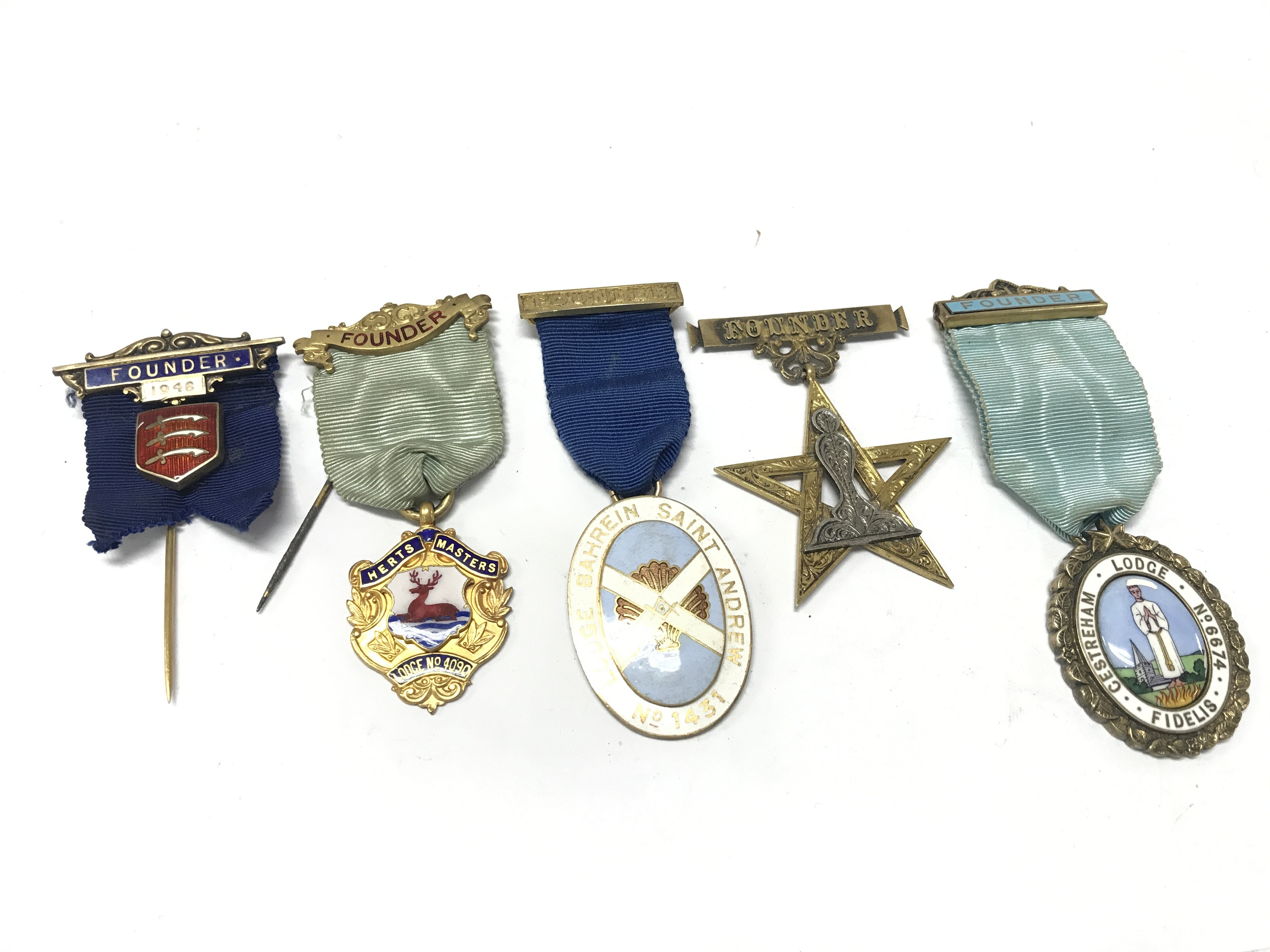 Four enamel and gilt metal Masonic Founders jewels Bahrain Saint Andrew Herts Masters Cestreham and others some silver , postage category A