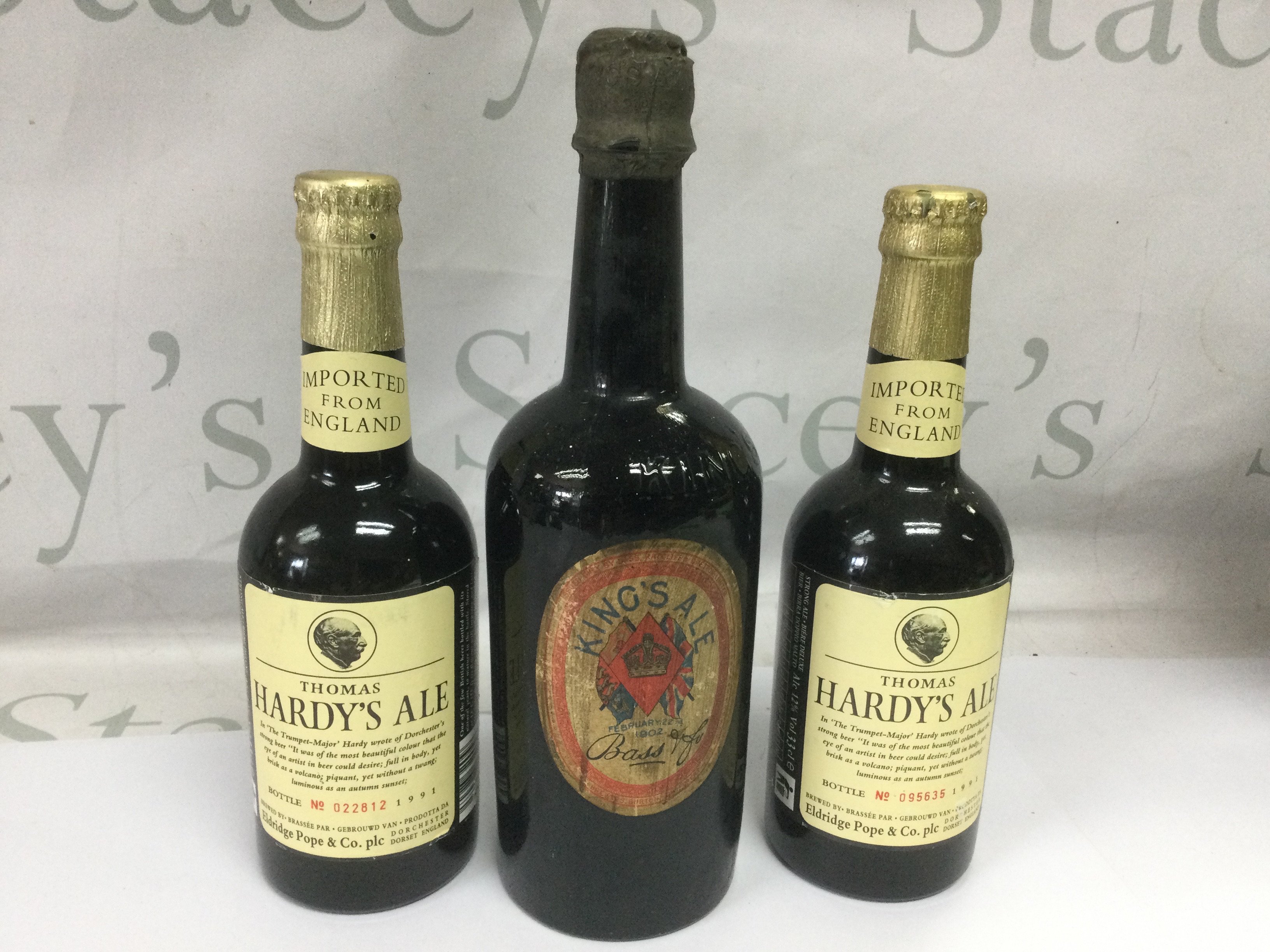 A 1902 bottle of King's Ale plus two bottles of limited edition and numbered Thomas Hardy ale (3). Shipping category D.