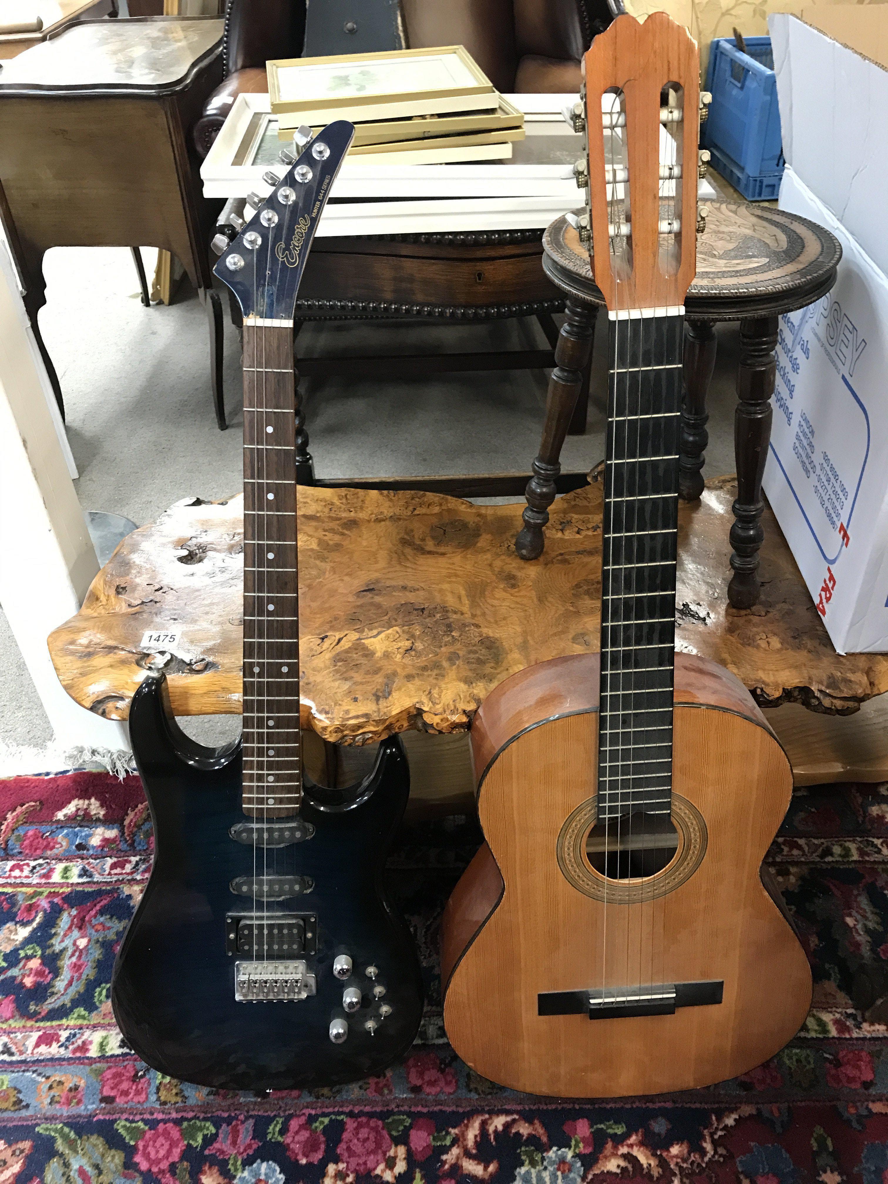 An Encore Hunter 644 series electric guitar and a Bespana classical acoustic guitar . This lot cannot be posted