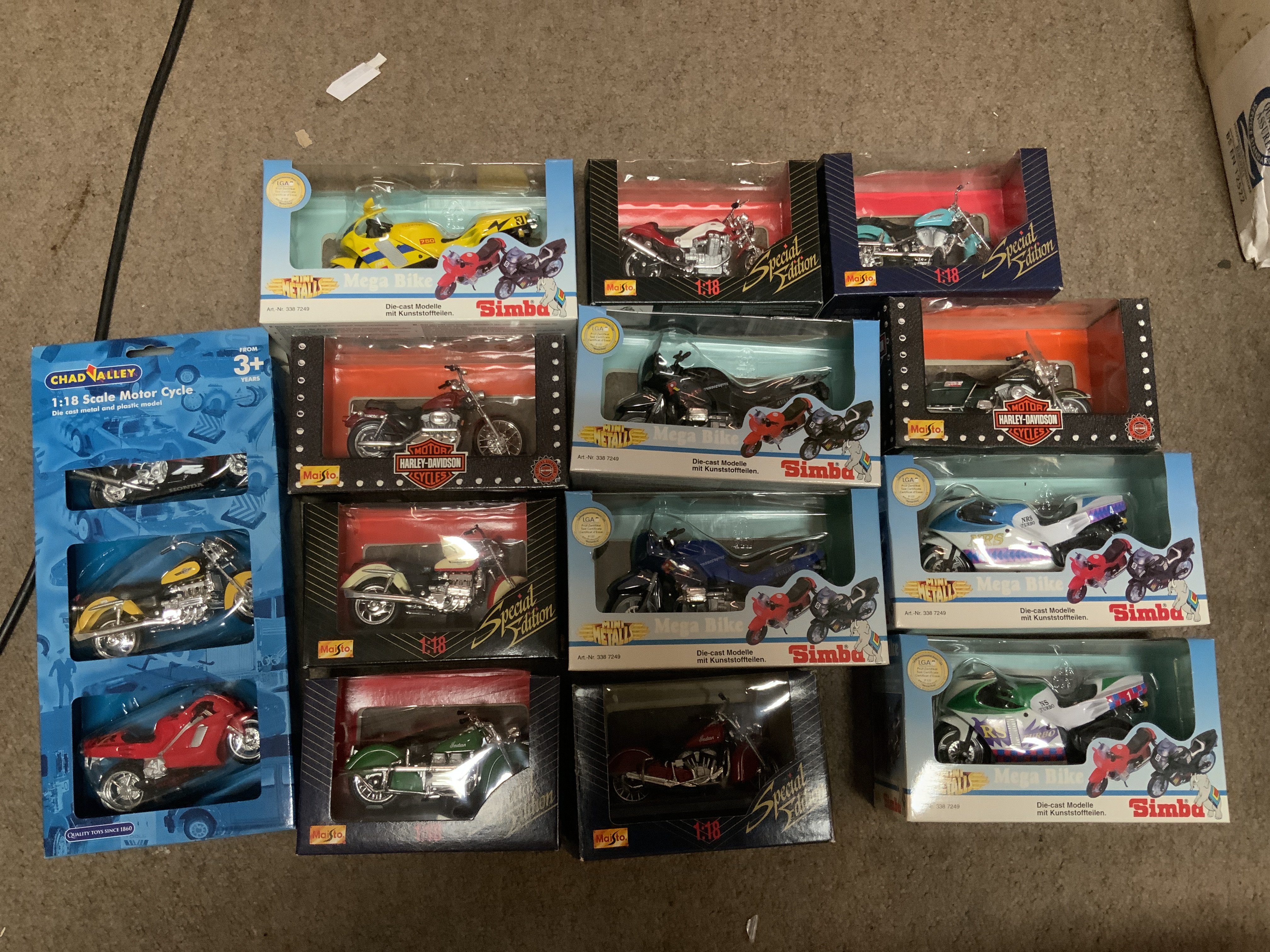 A small collection of Simba and Maitso boxed model motorcycles