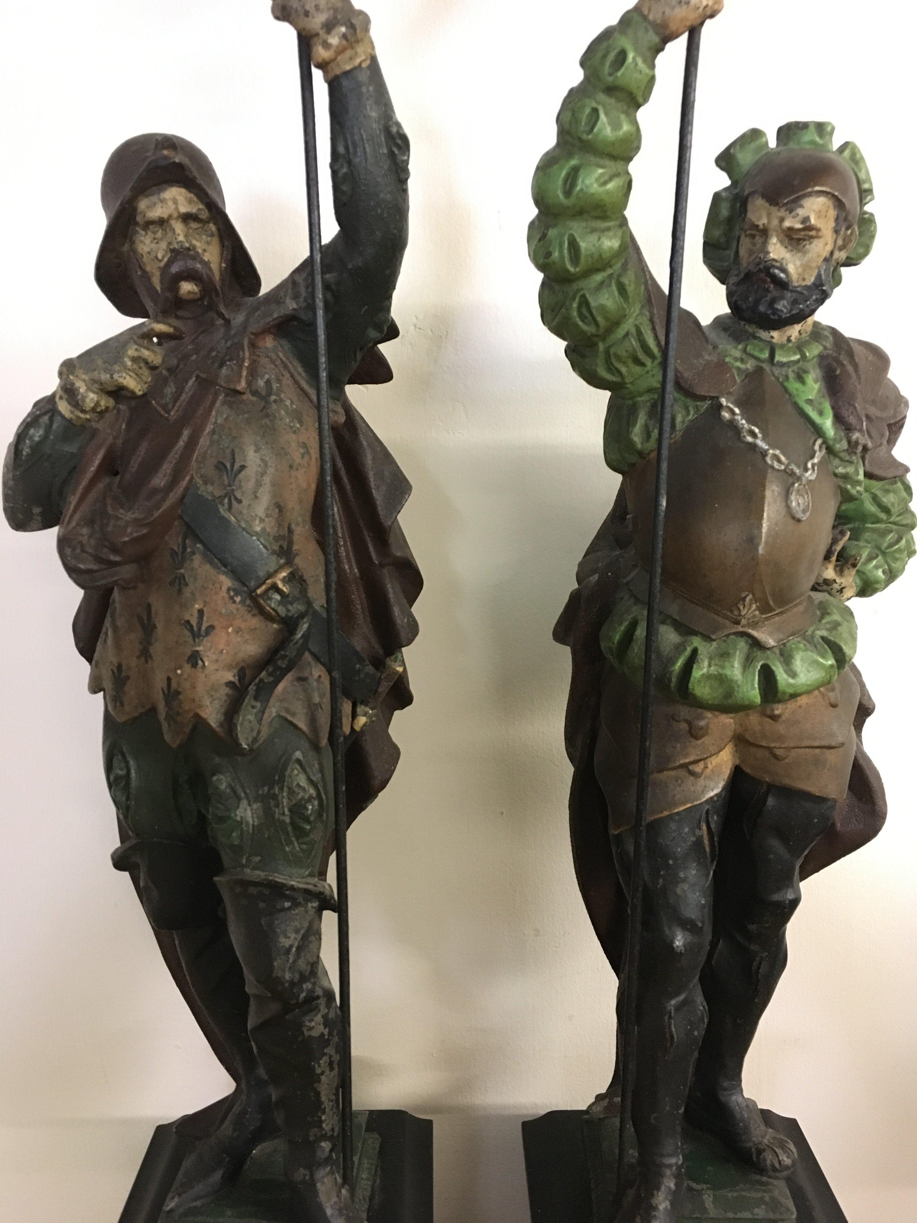 Two palace guards by A.P.S 1897 Painted spelter figures on marble and slate bases. 70cm tall