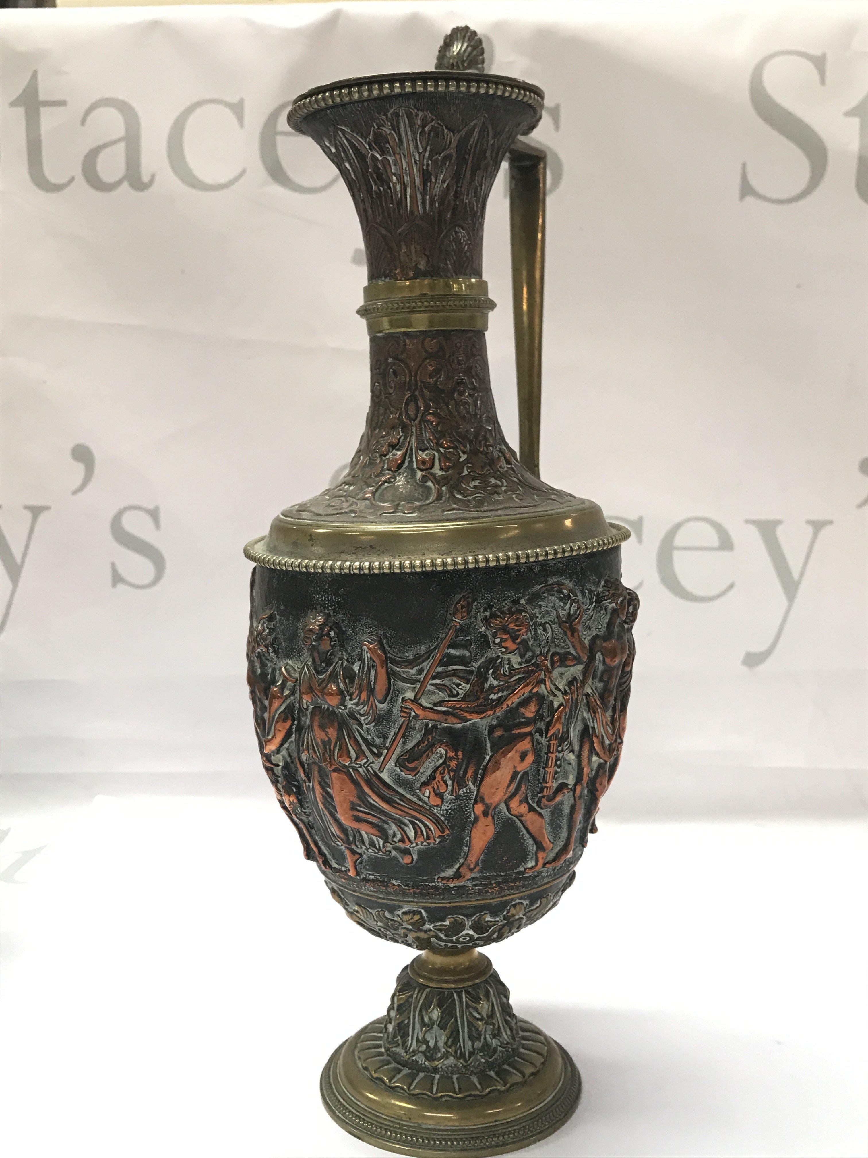 A Renaissance Revival Classical Ewer by JG & Sons (30cm tall approx) and a pair of matching goblets decorated with figures. (11.5cm tall)