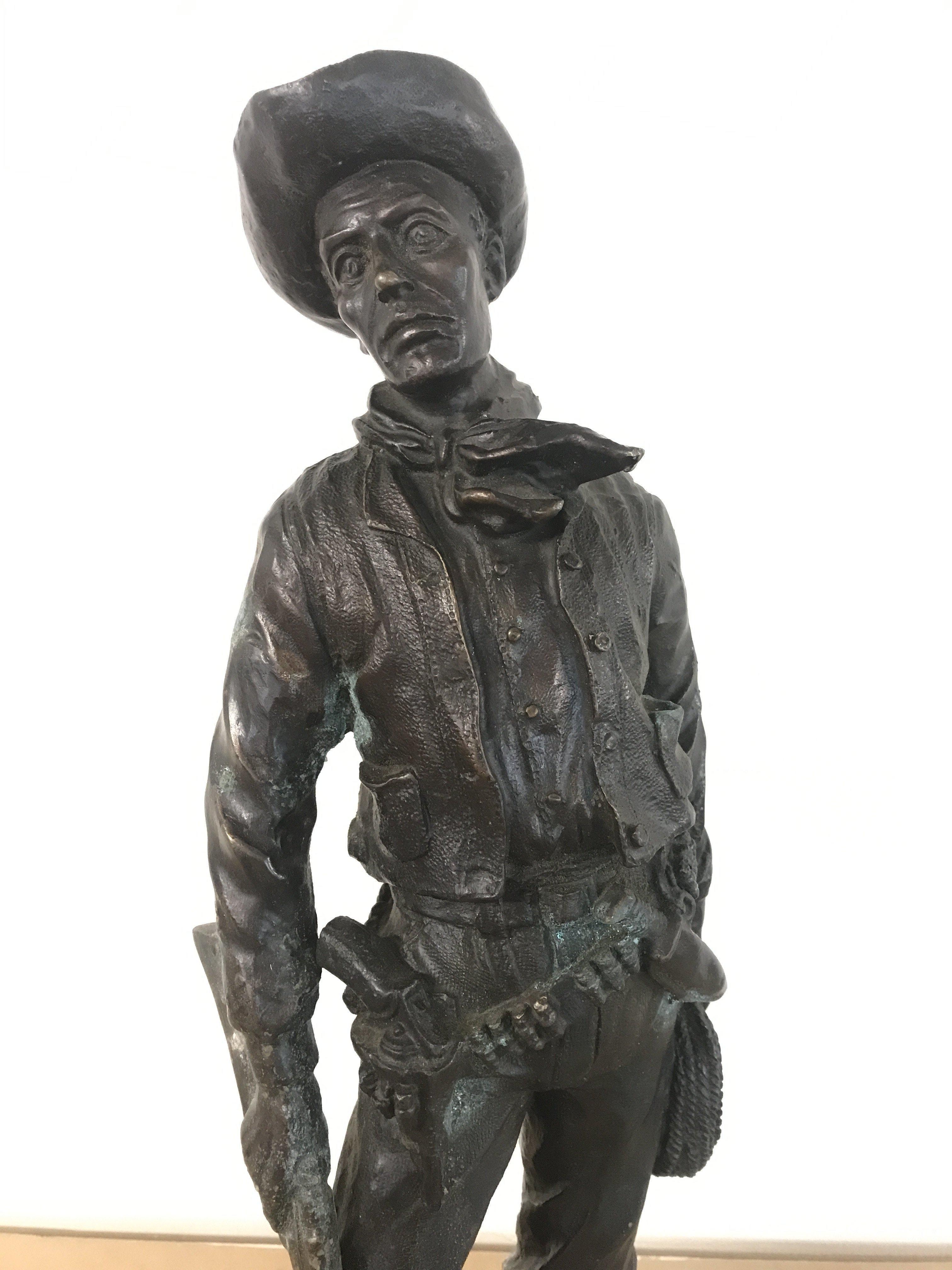 A cold cast resin Western Cowboy figure ,46cm tall. Postage category C- NO RESERVE