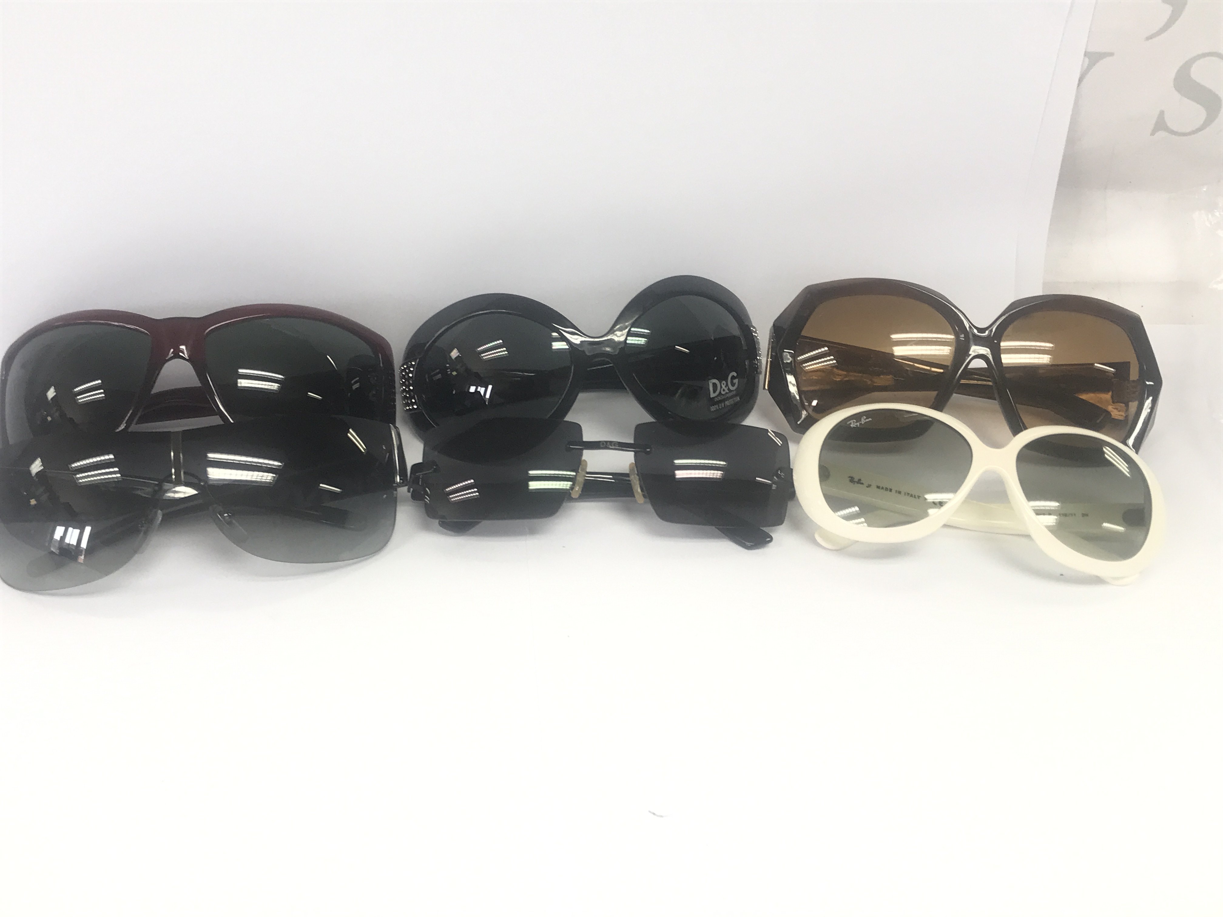 6 Designer sun glasses including Versace, DKNY, D&G, RayBan, Swarovski