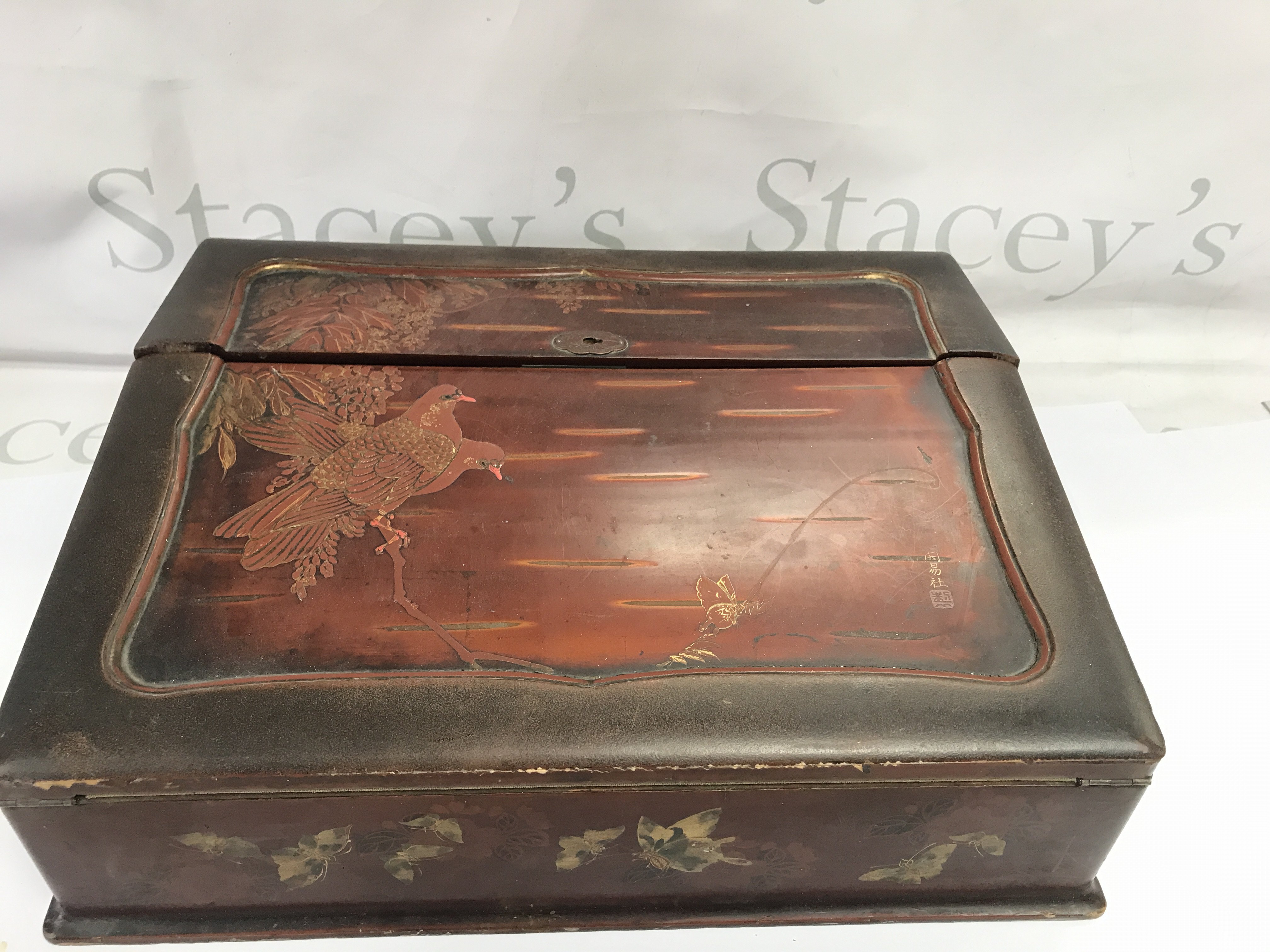 A lacquer writing slope. 38cm wide 30cm deep and 13cm high.