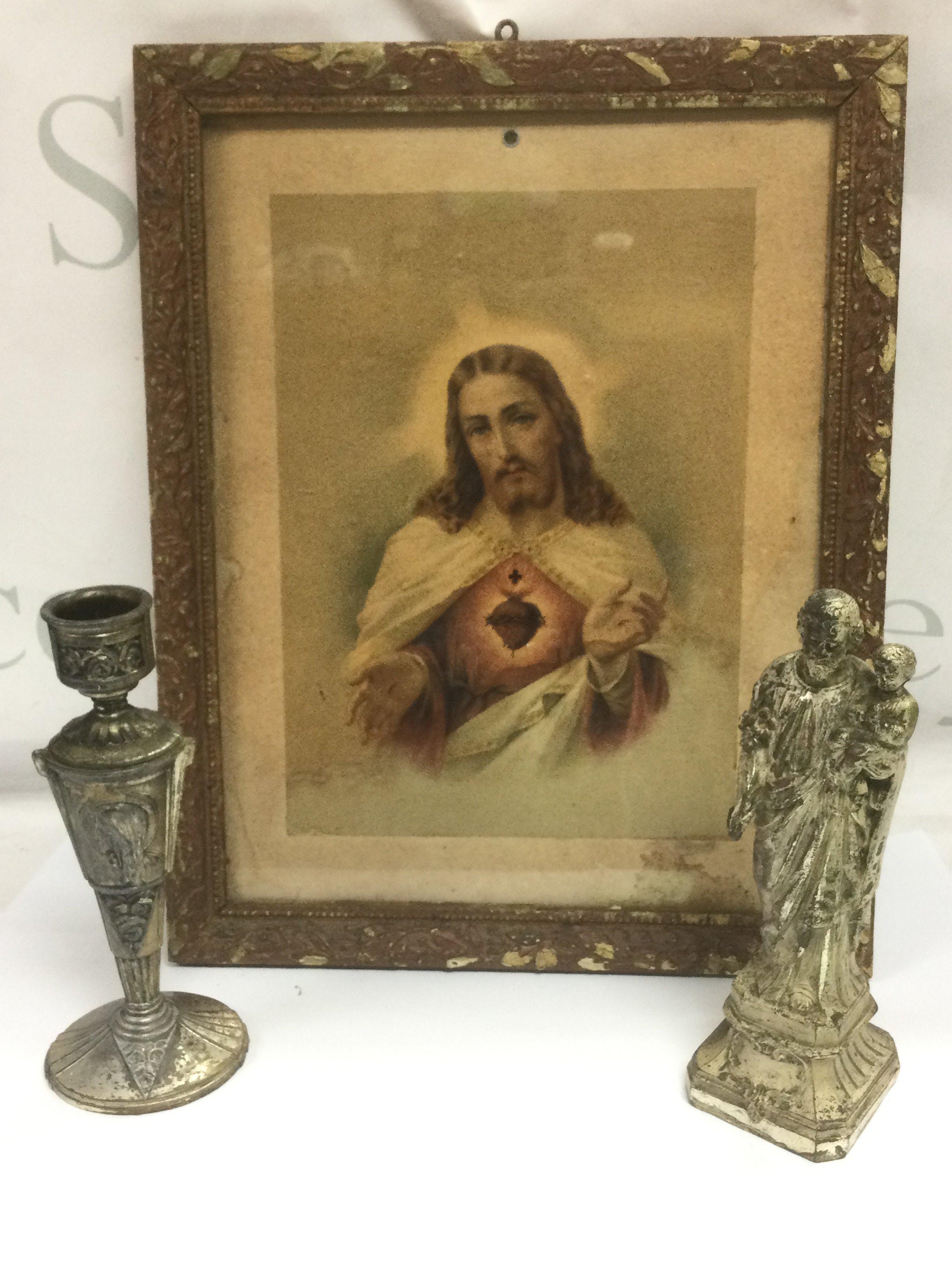 A French mixed metal candlestick and a small stature, approx height 18.5cm and a framed and glazed print of Christ (3). Shipping category D.