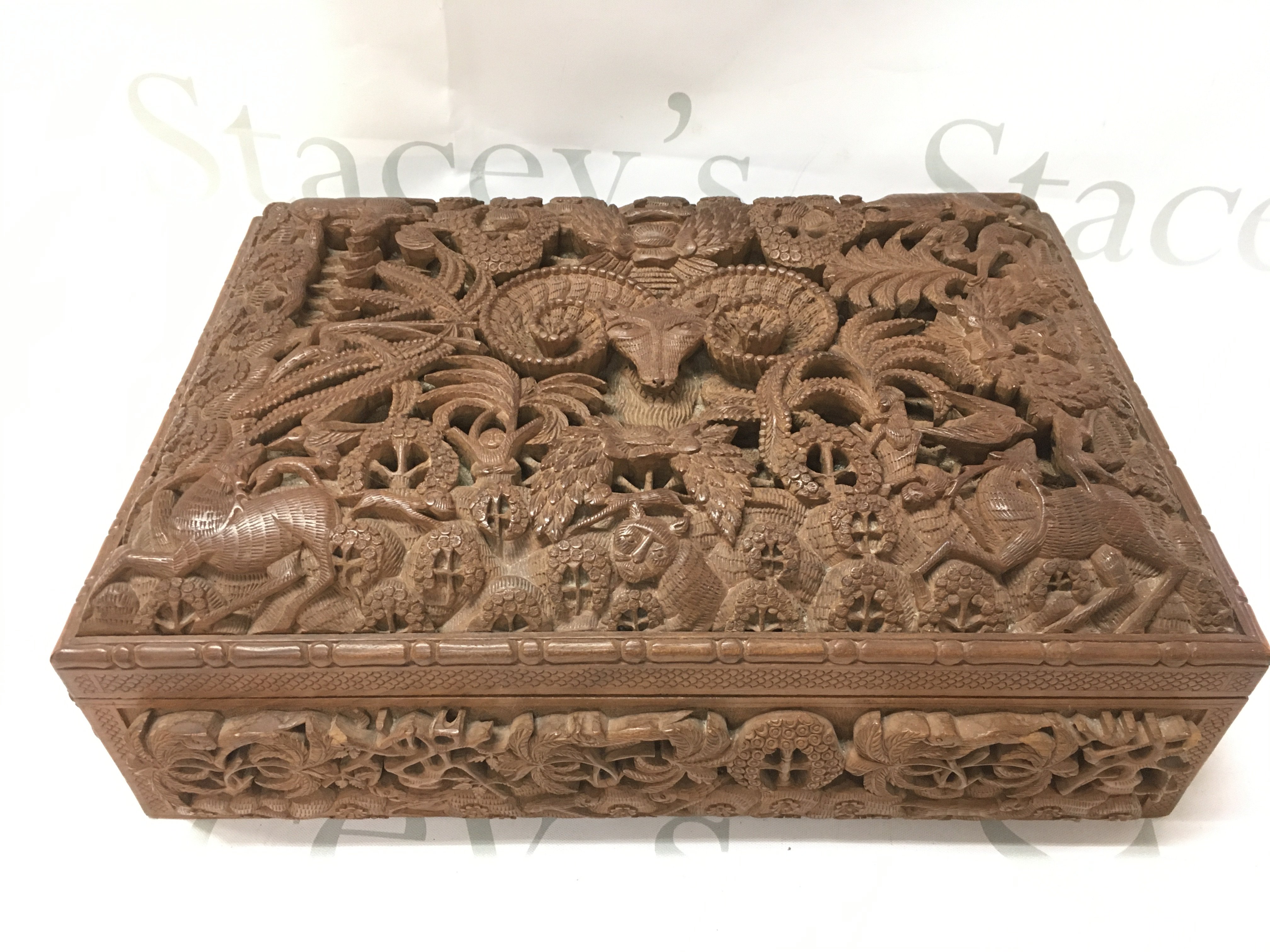 Anglo Indian Hardwood possibly walnut box with intricately carved animal decoration. Dimensions 24x34x13cmcm. Postage category C