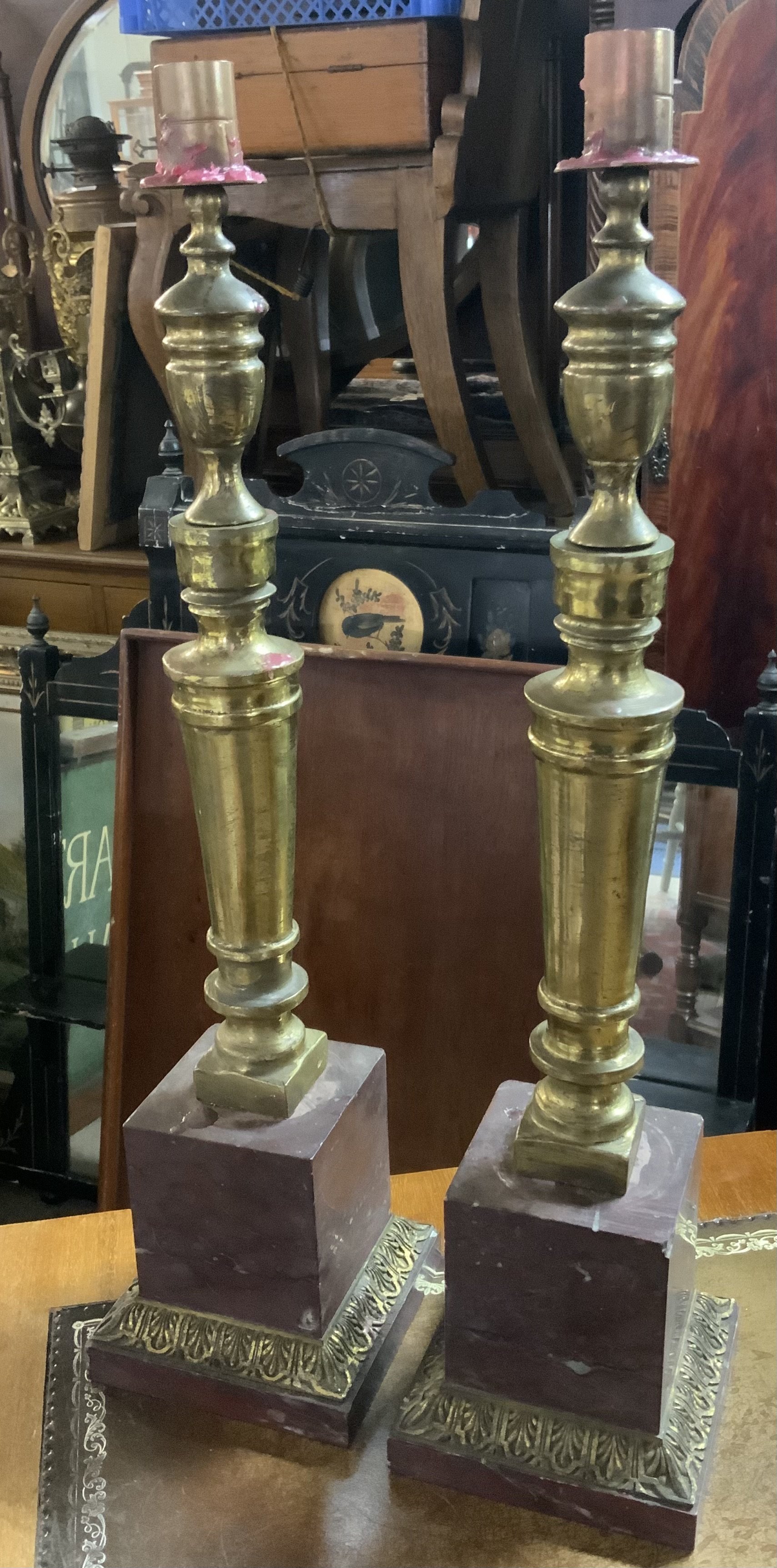A pair of Red marble and cast bronze candlesticks. 47cm.