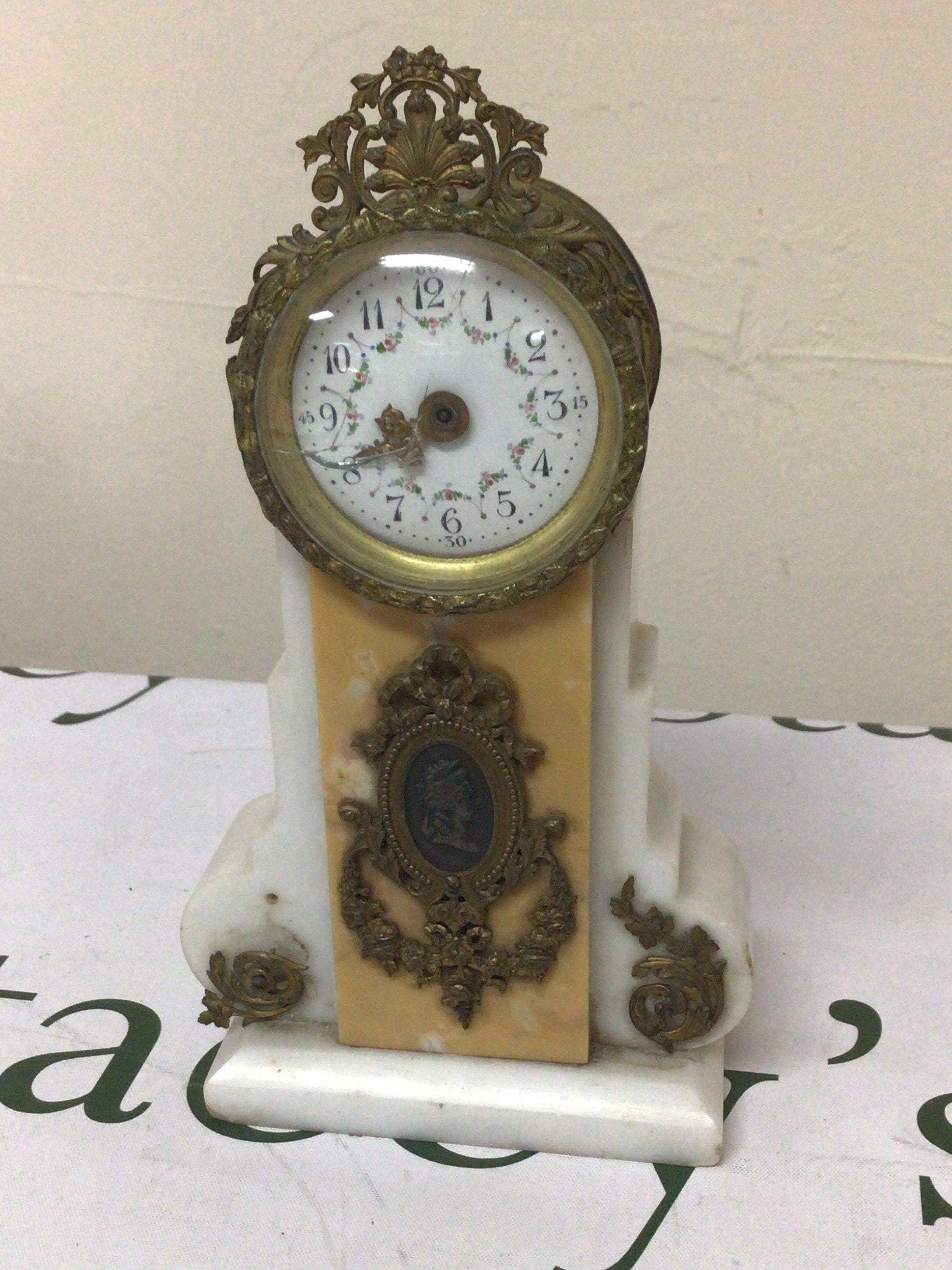 A French white marble clock with gilt metal punts for restoration. Hight 22cm