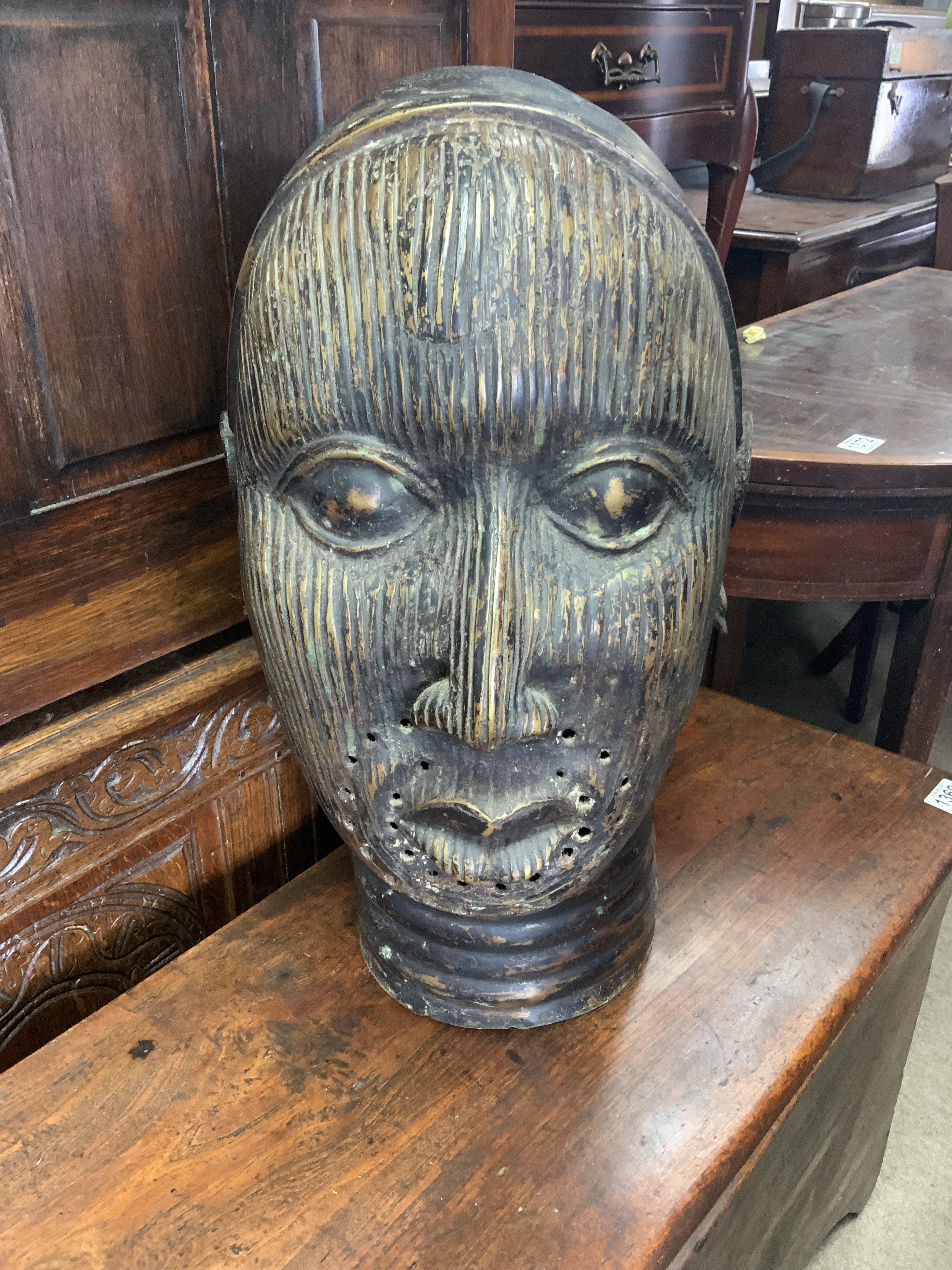 A large Benin bronze bust, (after the Ife, Yoruba people bronze head collection discovered in 1938), 54cm.
