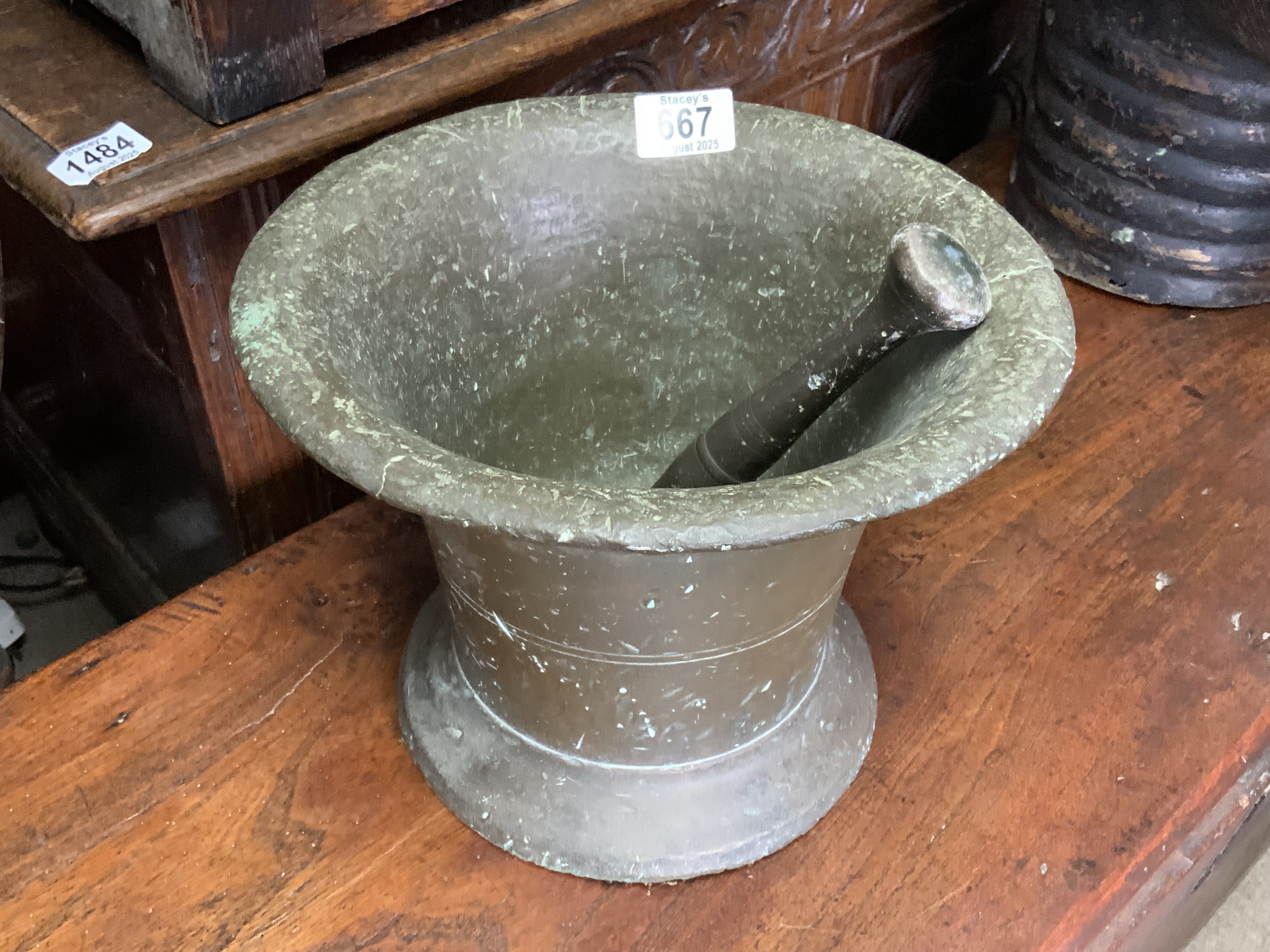A 17th or 18th bronze pestle and mortar, 27cm x 20cm