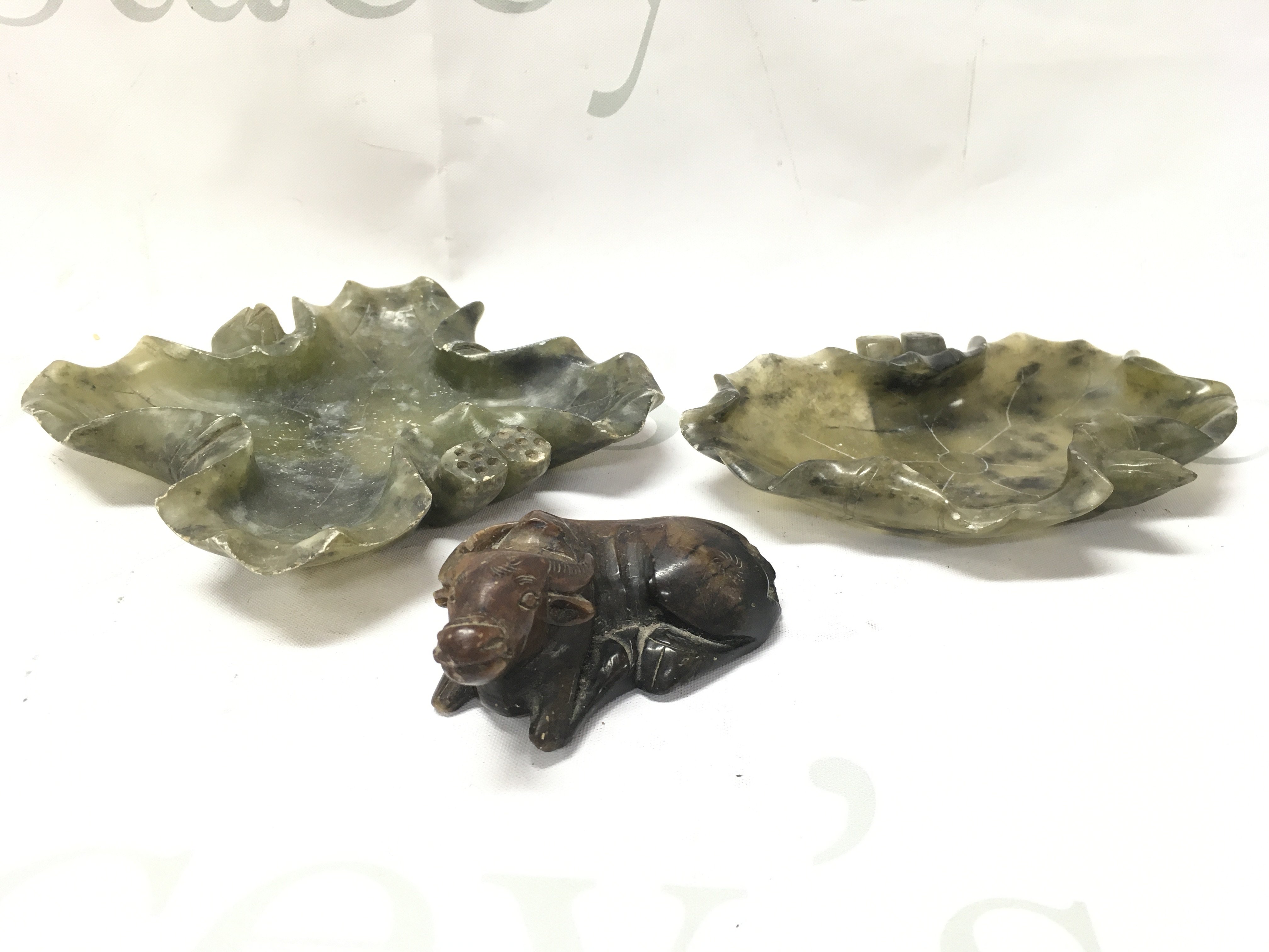 Two jade dishes and a soapstone water buffalo