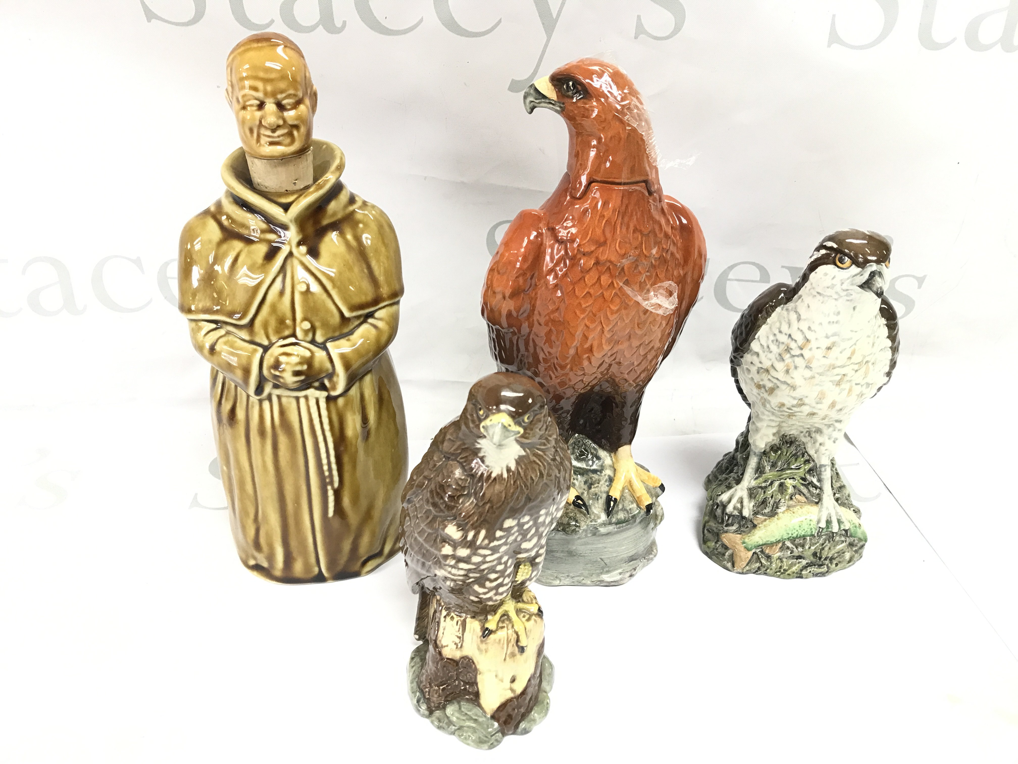 A collection of whisky bottles made by Beswick. Included one still sealed. Postage D