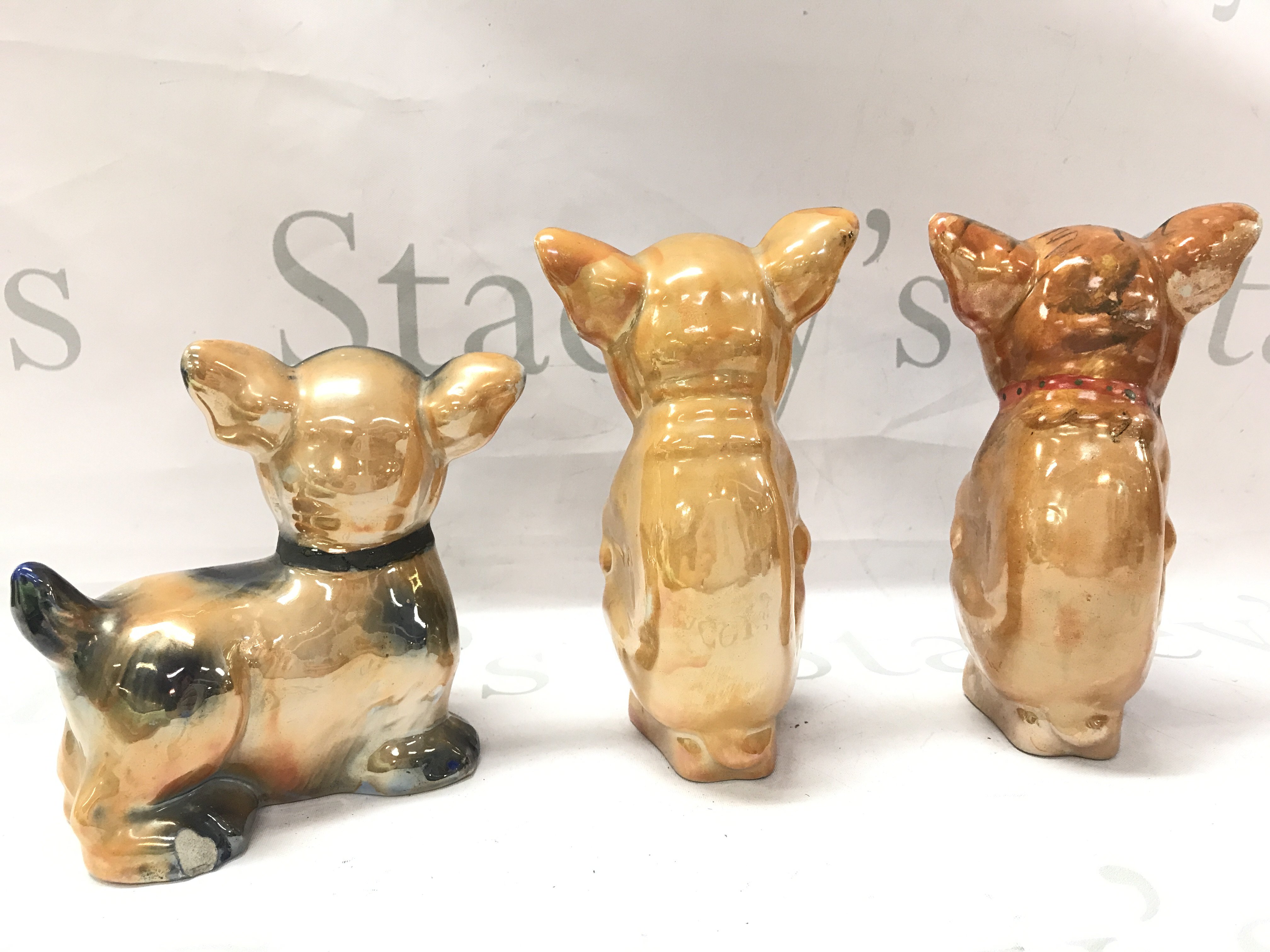 Three dog ornaments, 14 to 17cm tall. This lot cannot be posted- NO RESERVE