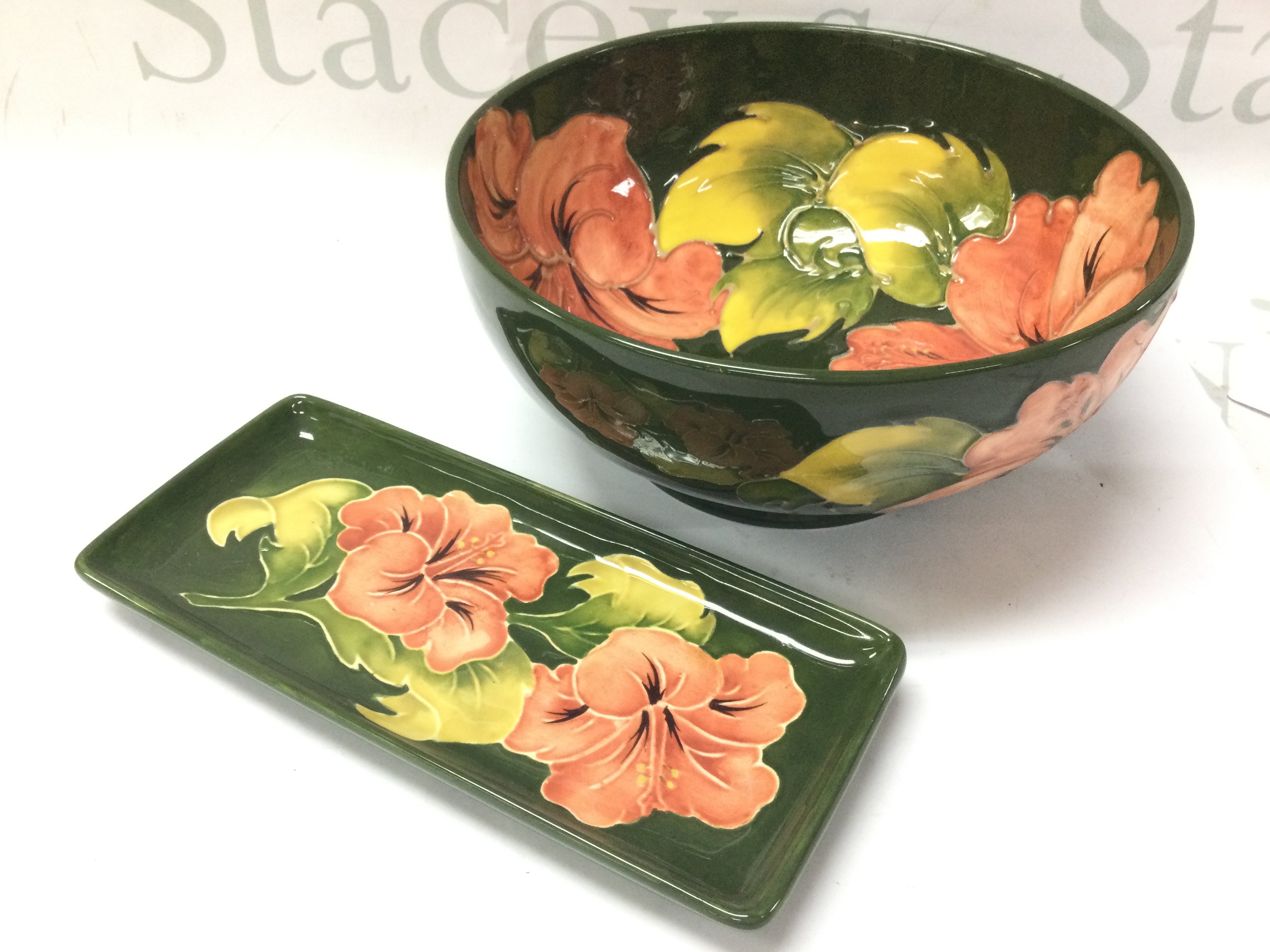 A Moorcroft limited edition of 200 Hibiscus bowl (9cm tall 20cm wide) and rectangular dish (20cm wide). No obvious damage or restoration. this lot cannot be posted