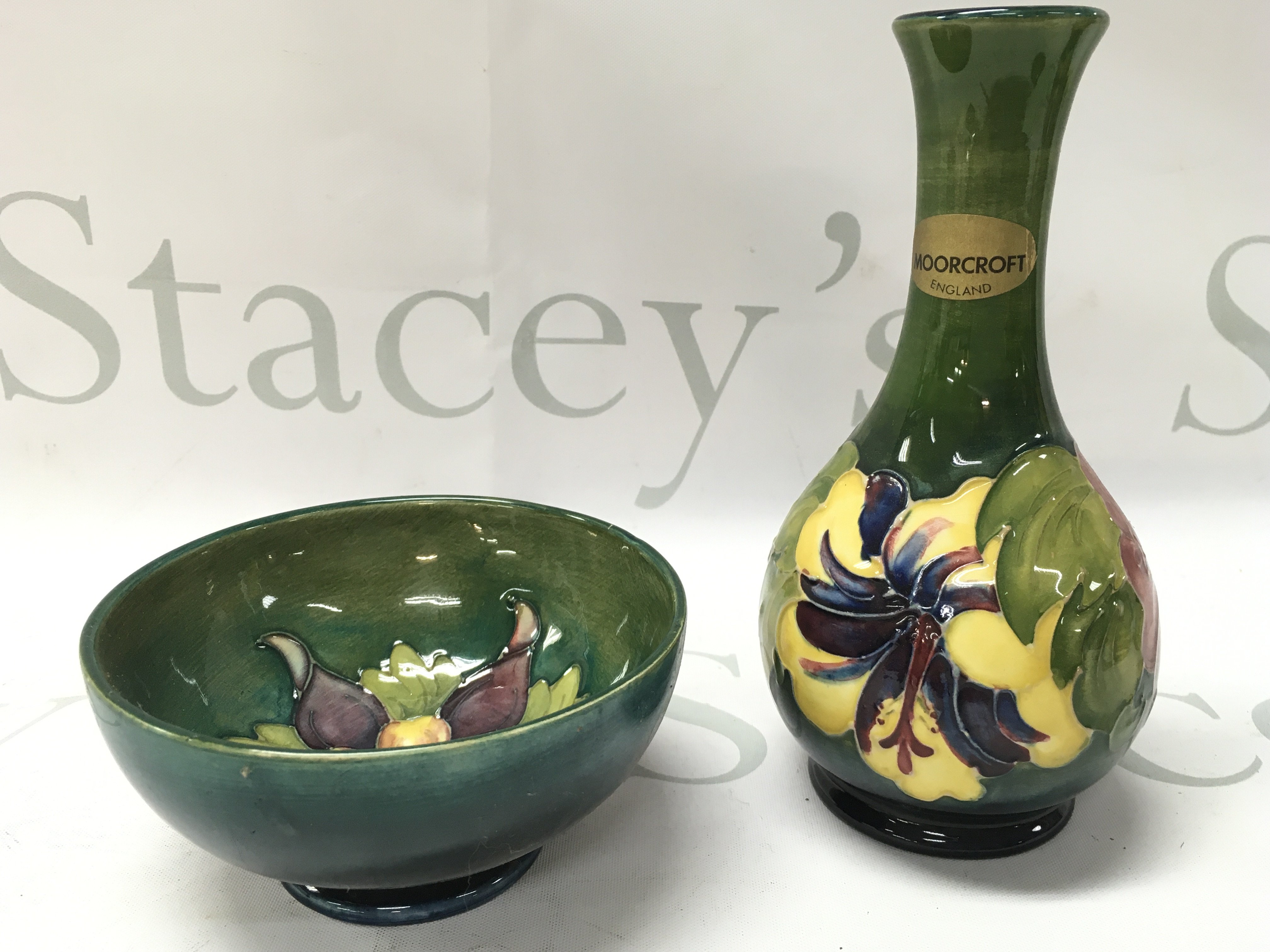 Moorcroft Hibiscus vase (16cm tall) and Columbine bowl (5.5cm tall 11cm wide). No obvious damage or restoration. This lot cannot be posted