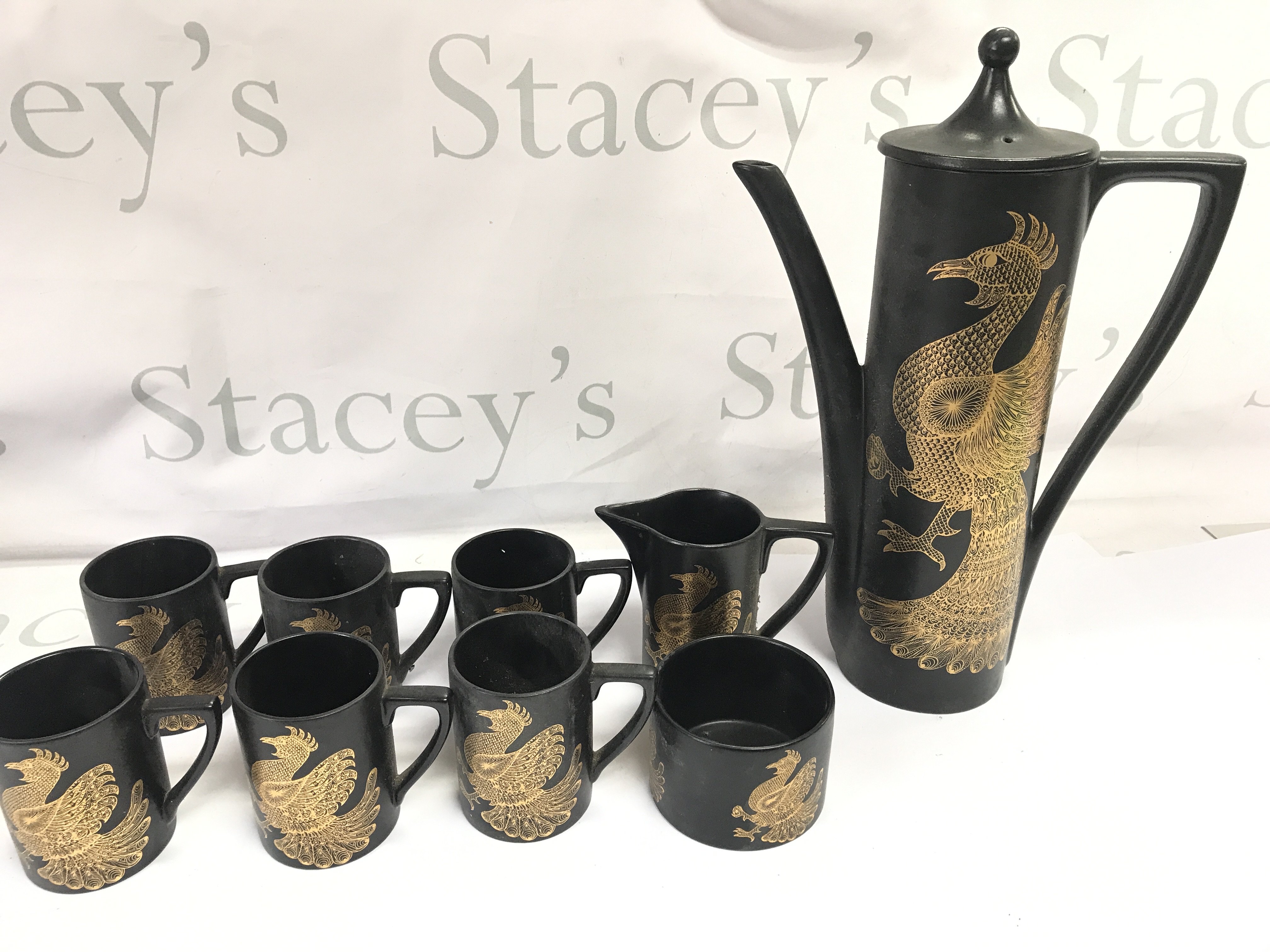 A Phoenix coffee set by John Cuffley. Postage D