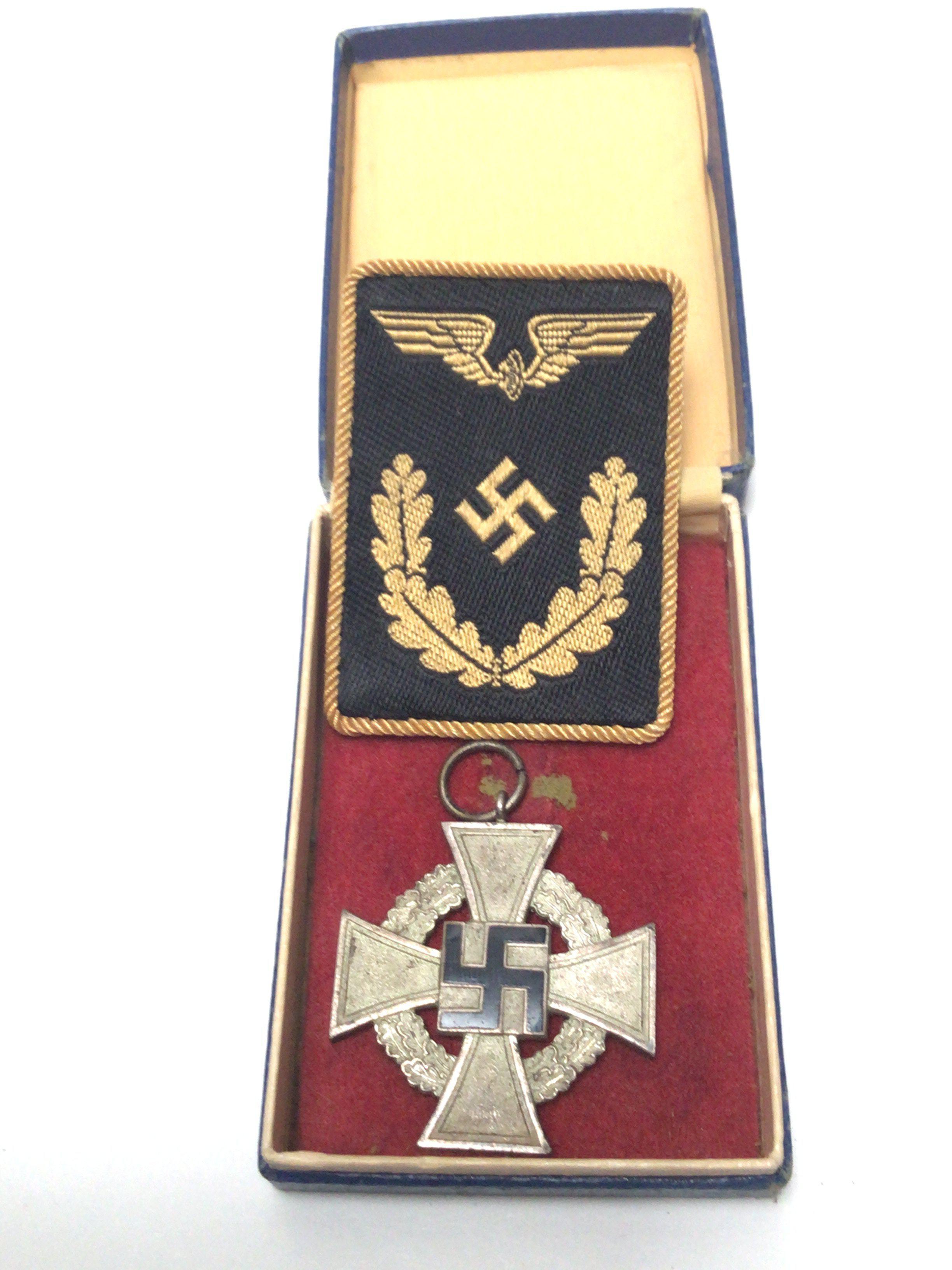 A German Third Reich SS long service medal with a cloth embroidered badge (2)