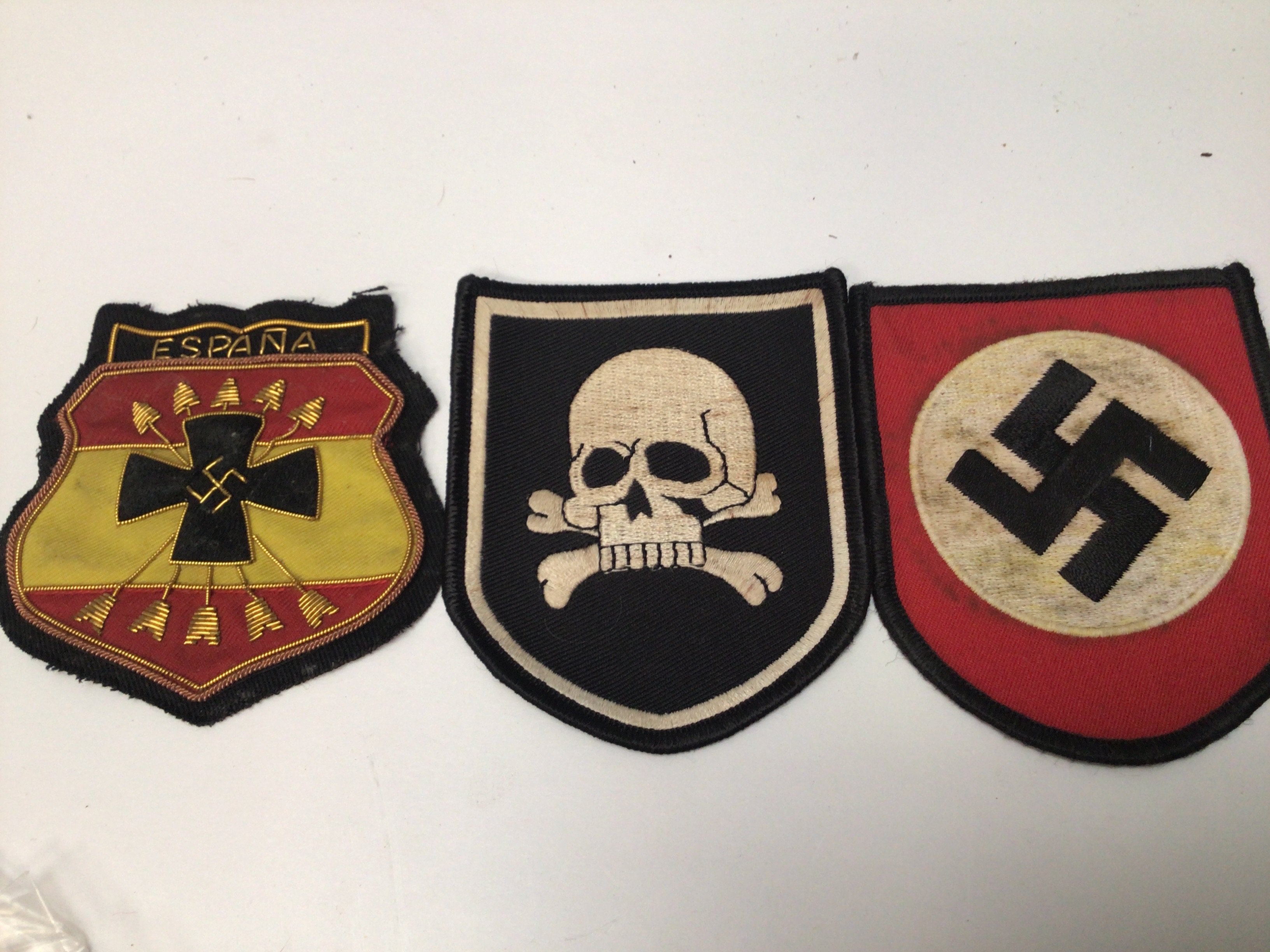 Three embroidered cloth badges a Spanish Third Reich and SS. (3)