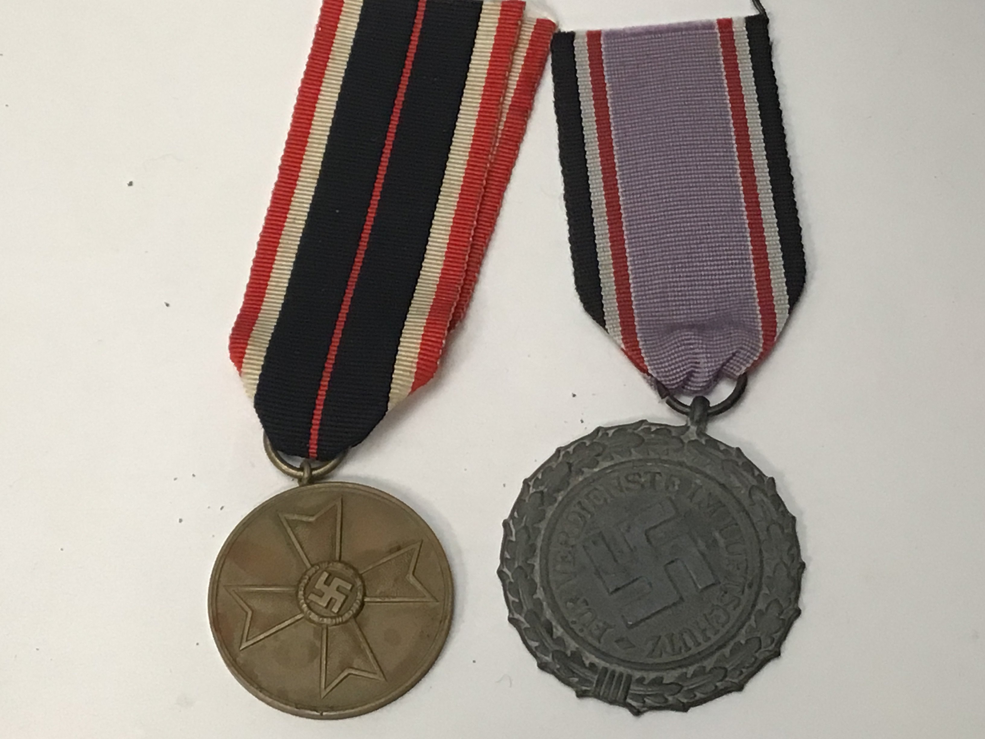 A German Third Reich Air Raid Defence Medal Second Class and a civilian merit metal (2)