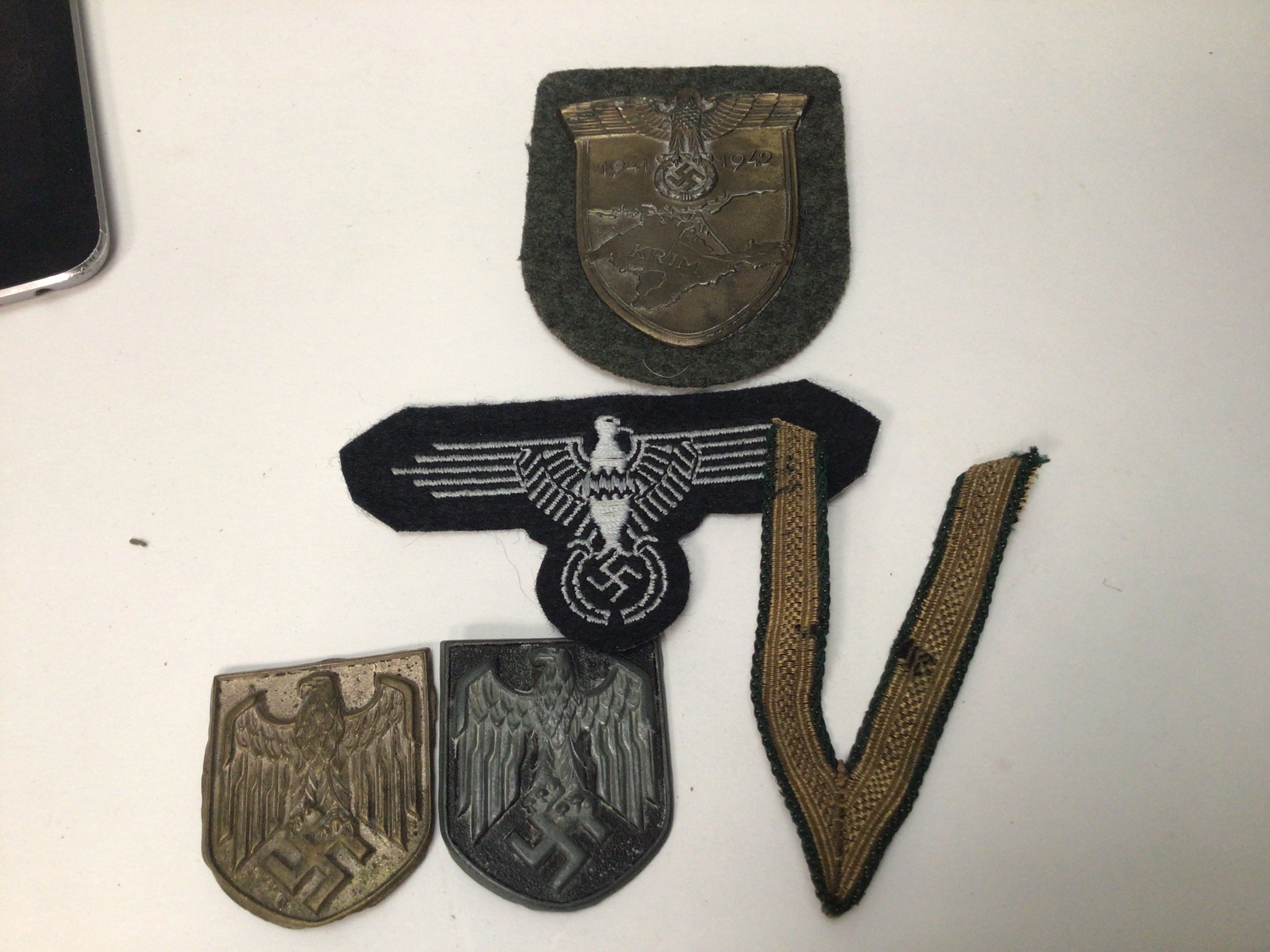 A Russian Front badge Two German Afrika Korps badges and others