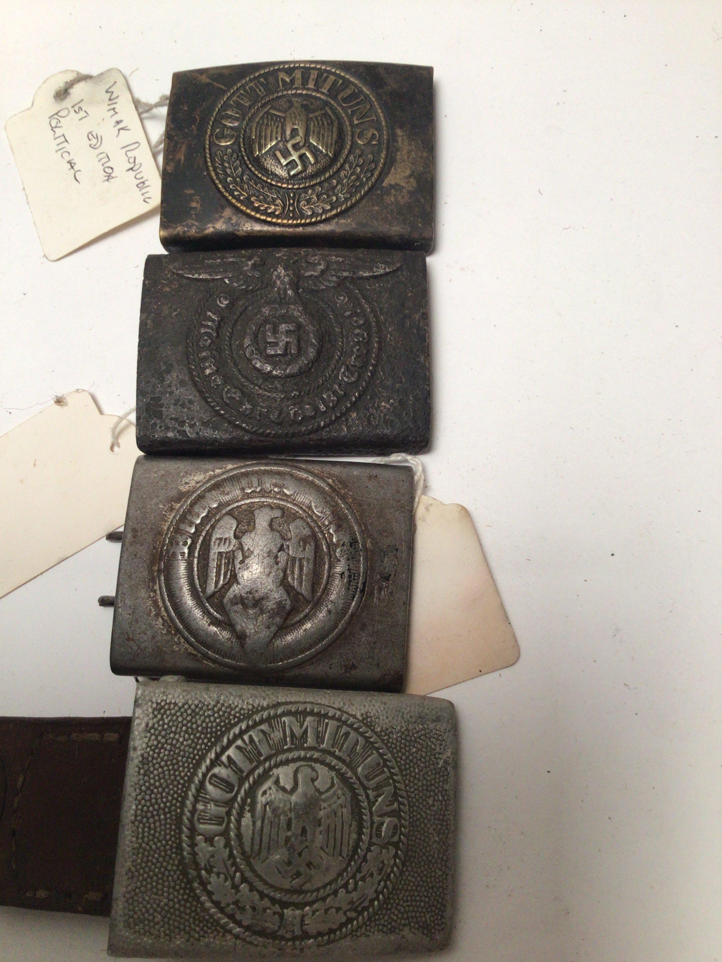 Four German Third Reich belt buckles including Hitler Youth SS and Army buckles. (4)