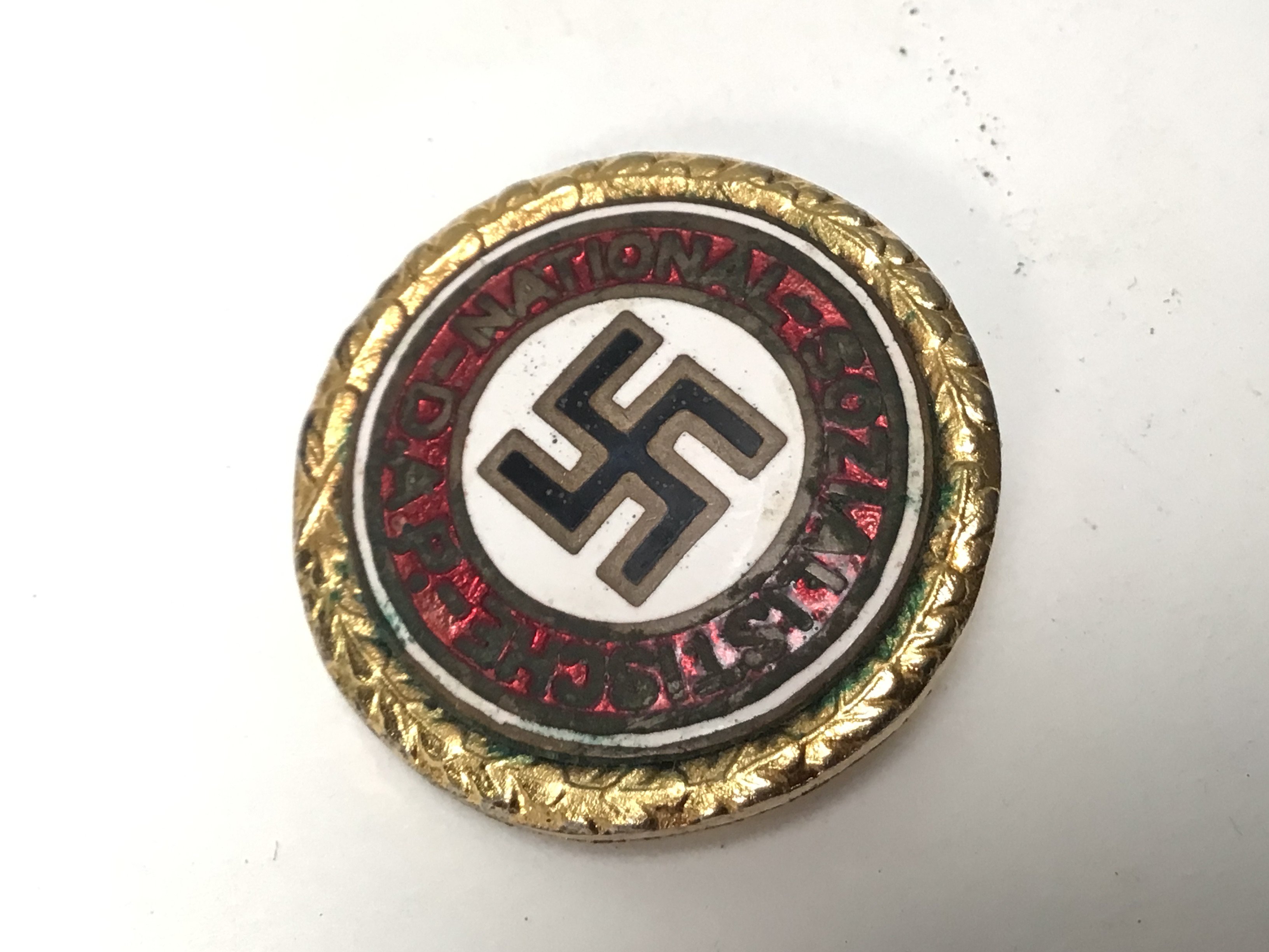 A Very interesting Gold Coloured Metal and enamel German NSDAP party badge given for continued unbroken membership.The 30mm badge has stamp marks Ges. Gesch Munchen9 and most significantly is numbered 32 this the type 2 badge. The earlier number reflects that it was most likely given to a High Leader. Hitler gave badge 7 to his Chancellor Dr Otto Meissner.
