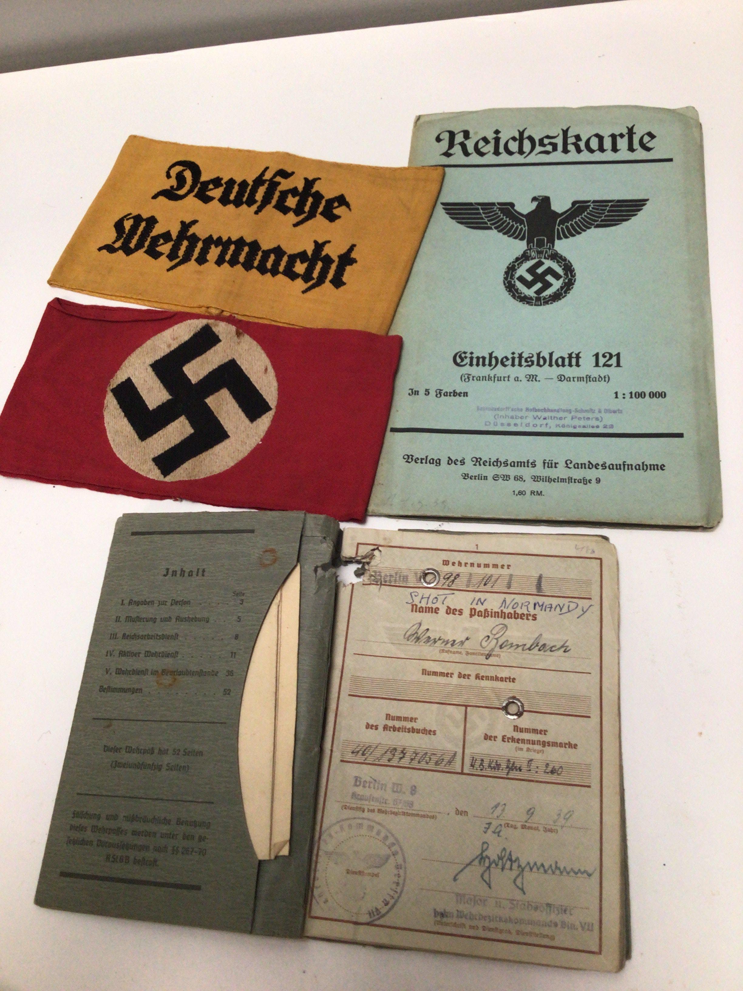 A German ID book dated 1939 two German Nazi party Arm bands and a German Third Reich map.
