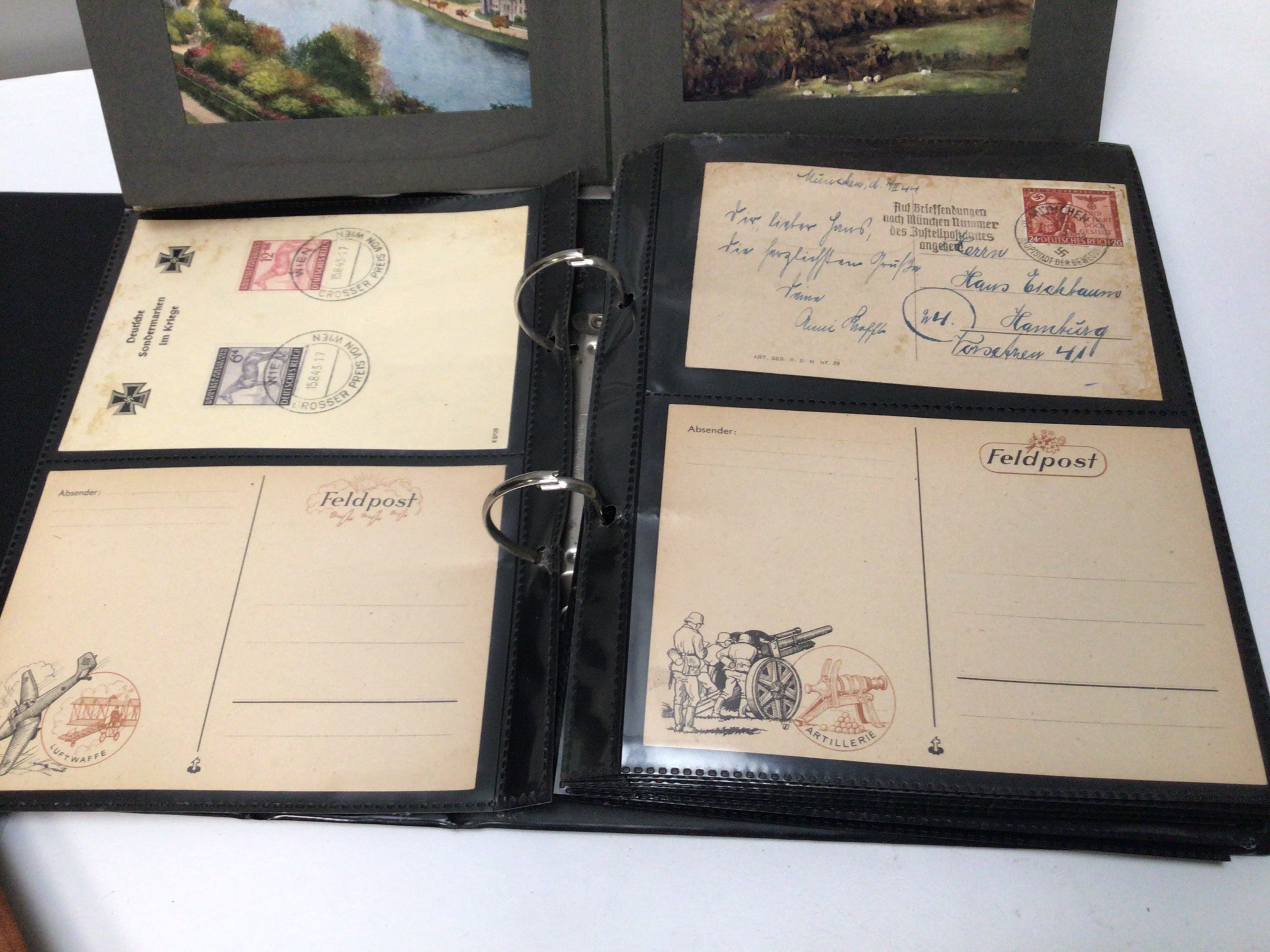 Three albums containing post cards including German Third Reich postcards and other world cards.