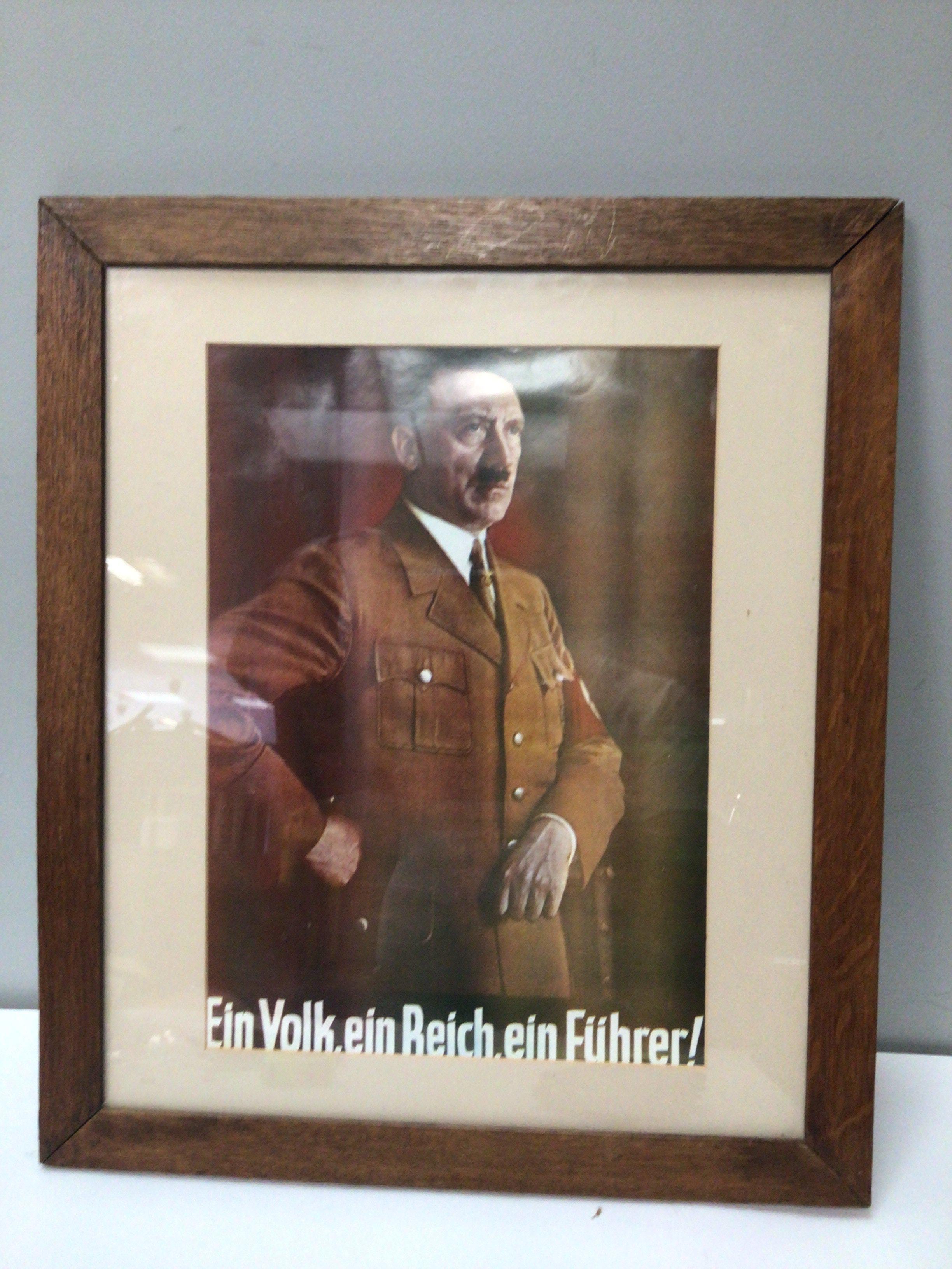 A German II world war colour poster portrait of Adolf Hitler and with the text One People One Empire One Leader.