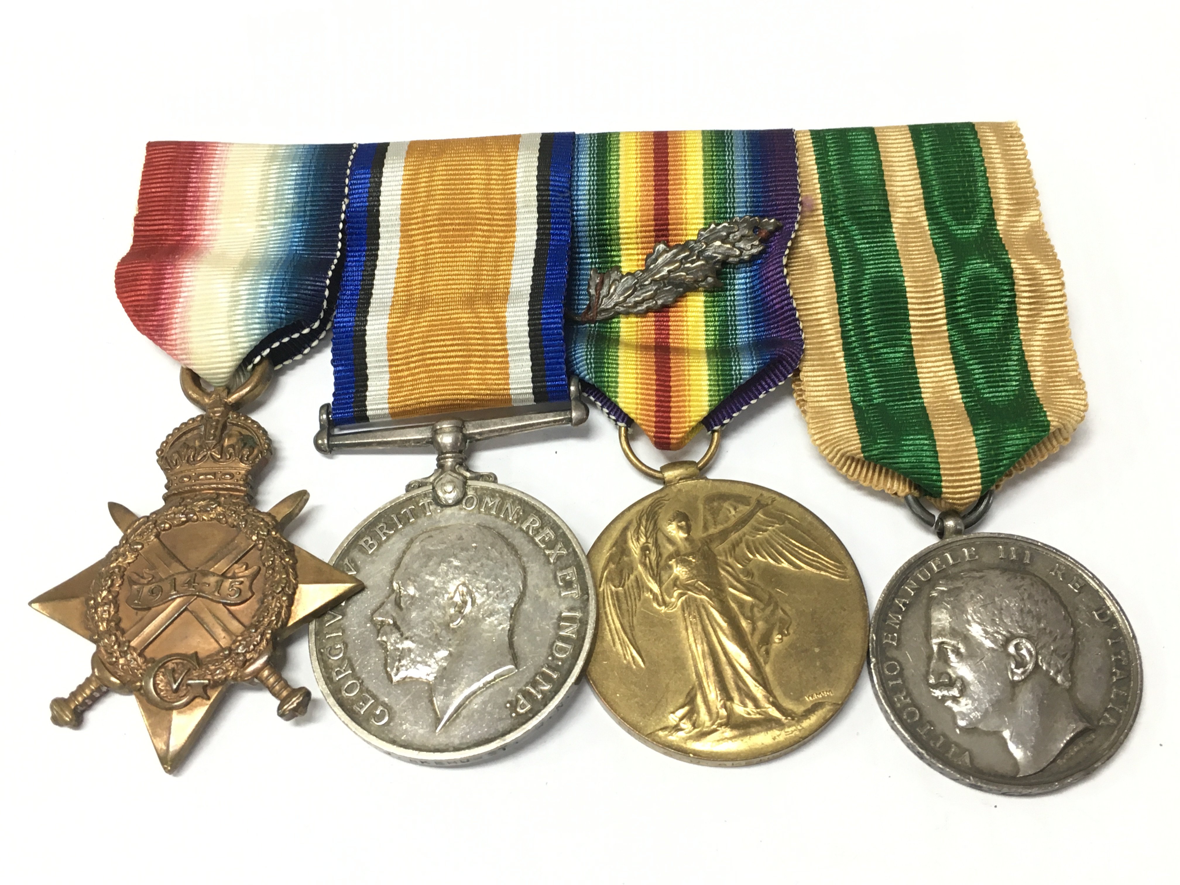 WW1 British medal group including a 1914-15 star presented to a 184202 A.J. Akehurst P.O..R.N, War medal presented to GNR.A.J.Ak ehurst . R.N, victory medal (with oak leaf) presented to Ehurst and a silver Merit medal, Italian Messina Earthquake, 23 December 1908 with inscription A.Akehurst.1stCL.PO.HMS.Lancaster. Postage category B