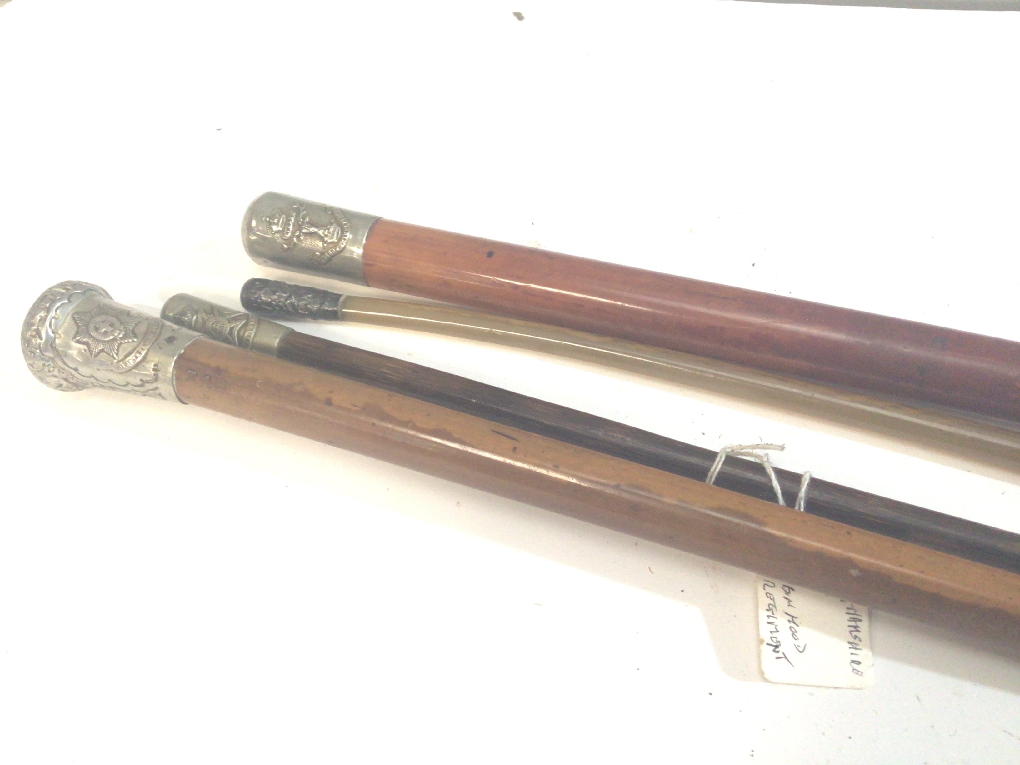 Four Military Swagger and walking sticks including a horn swagger stick Gordon Hylanders and others (4)