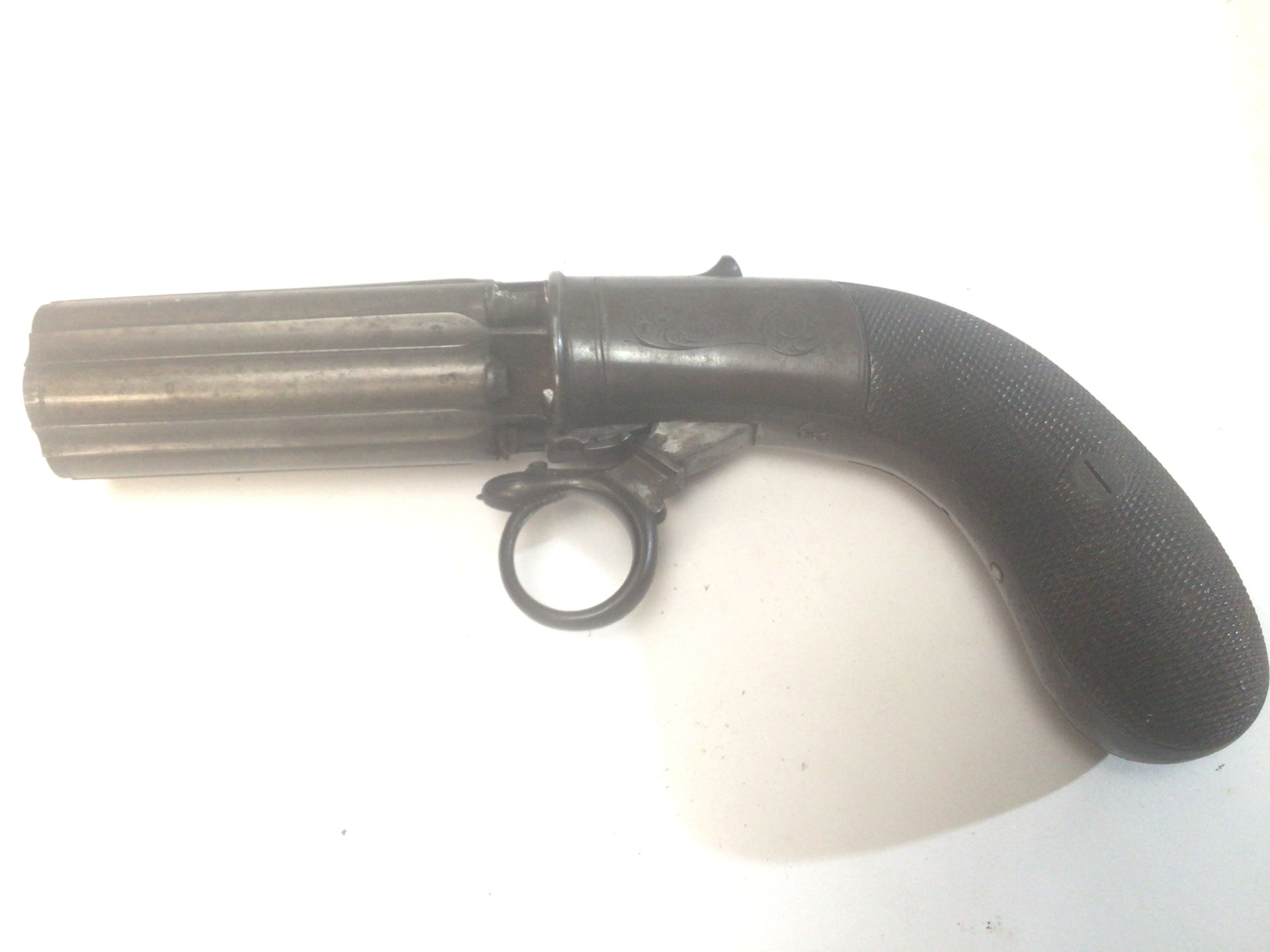 A 19th Century Six shot pepper pot revolver numbered barrel J R Coopers Patent action functions