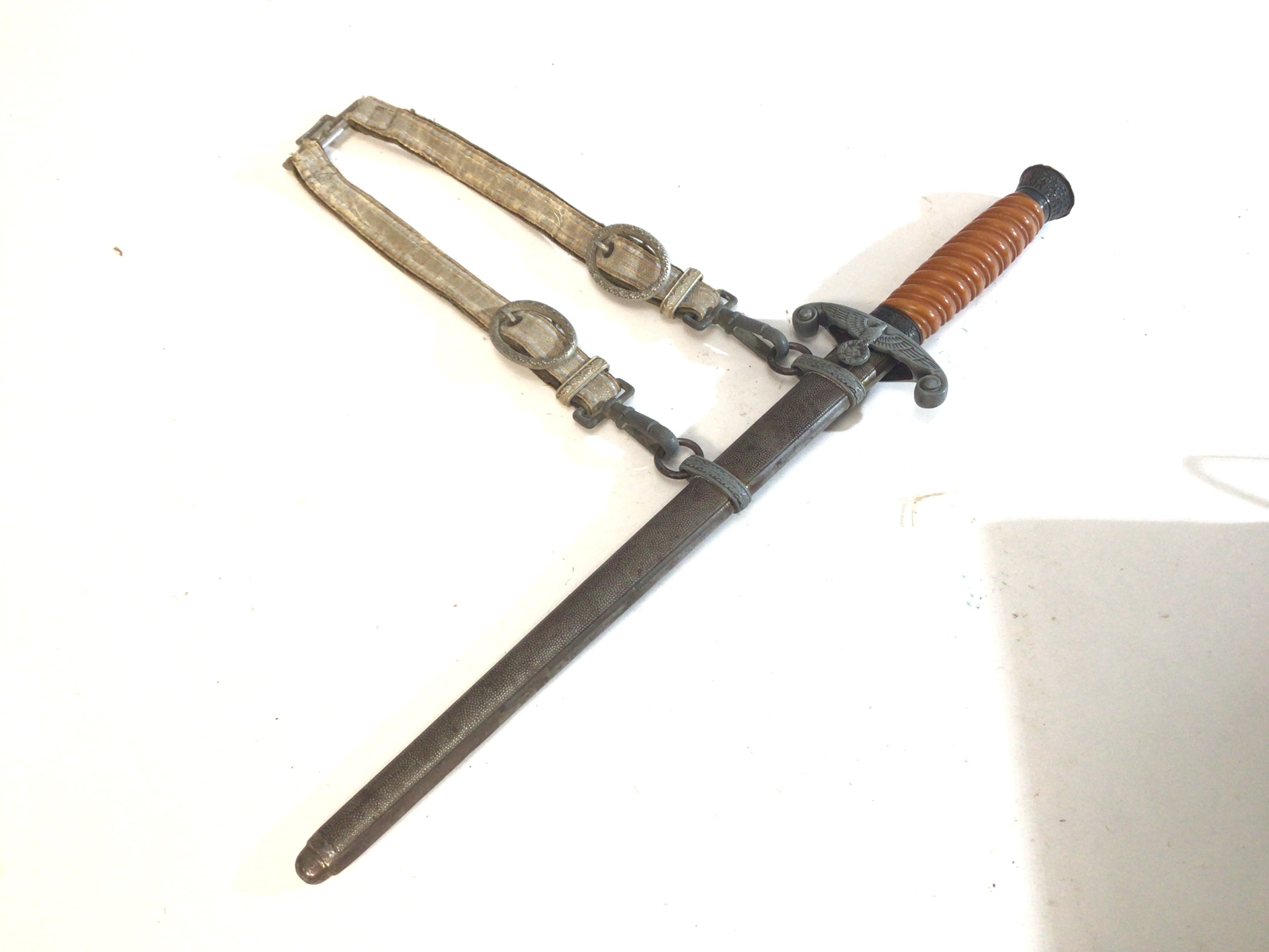 A German Third Reich II world war officers presentation dagger with original hanger the blade with makers stamp.
