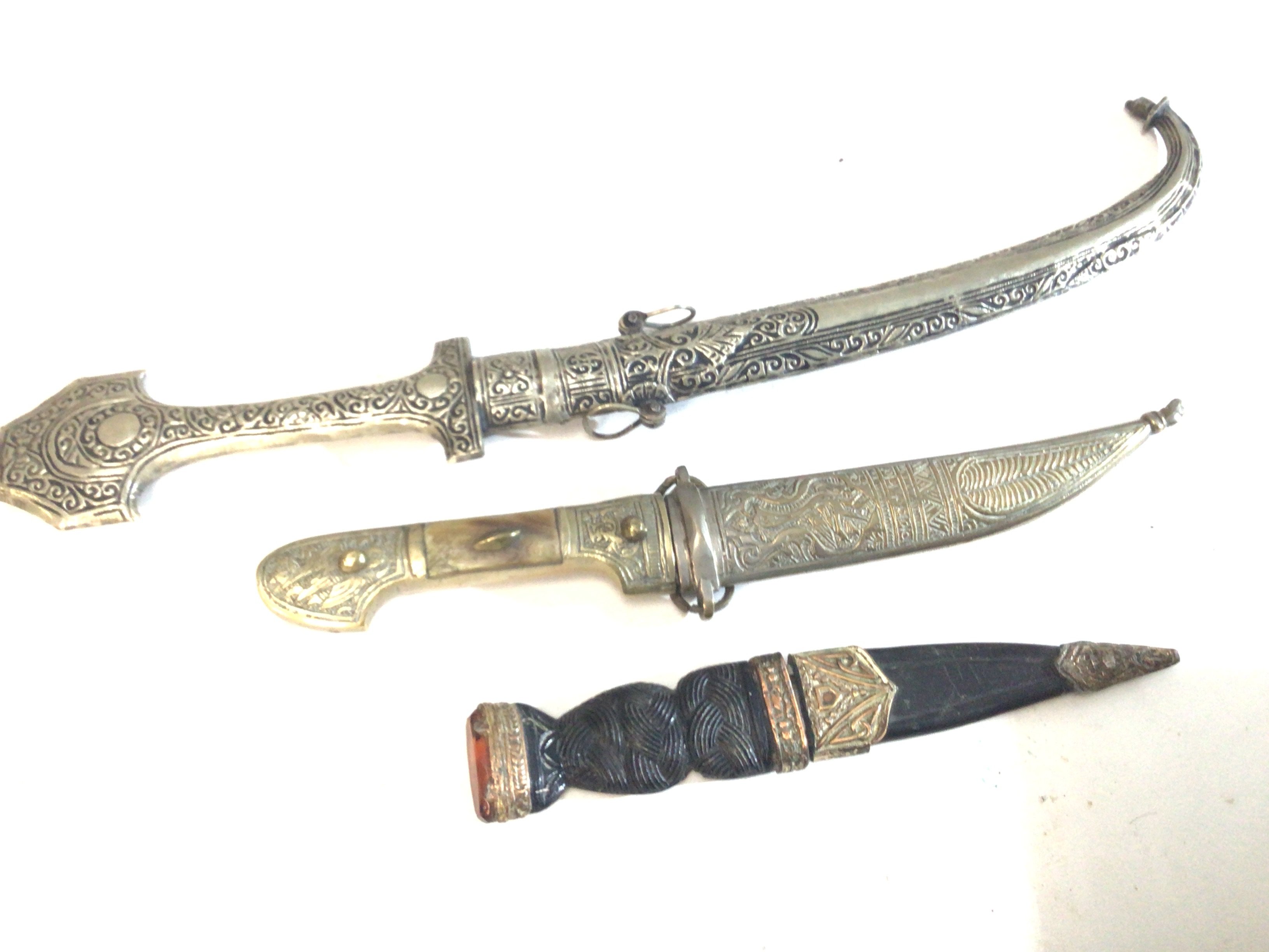 A Scottish skein-Dhu knife maker Nowill & Son and two other Middle Eastern daggers (3)