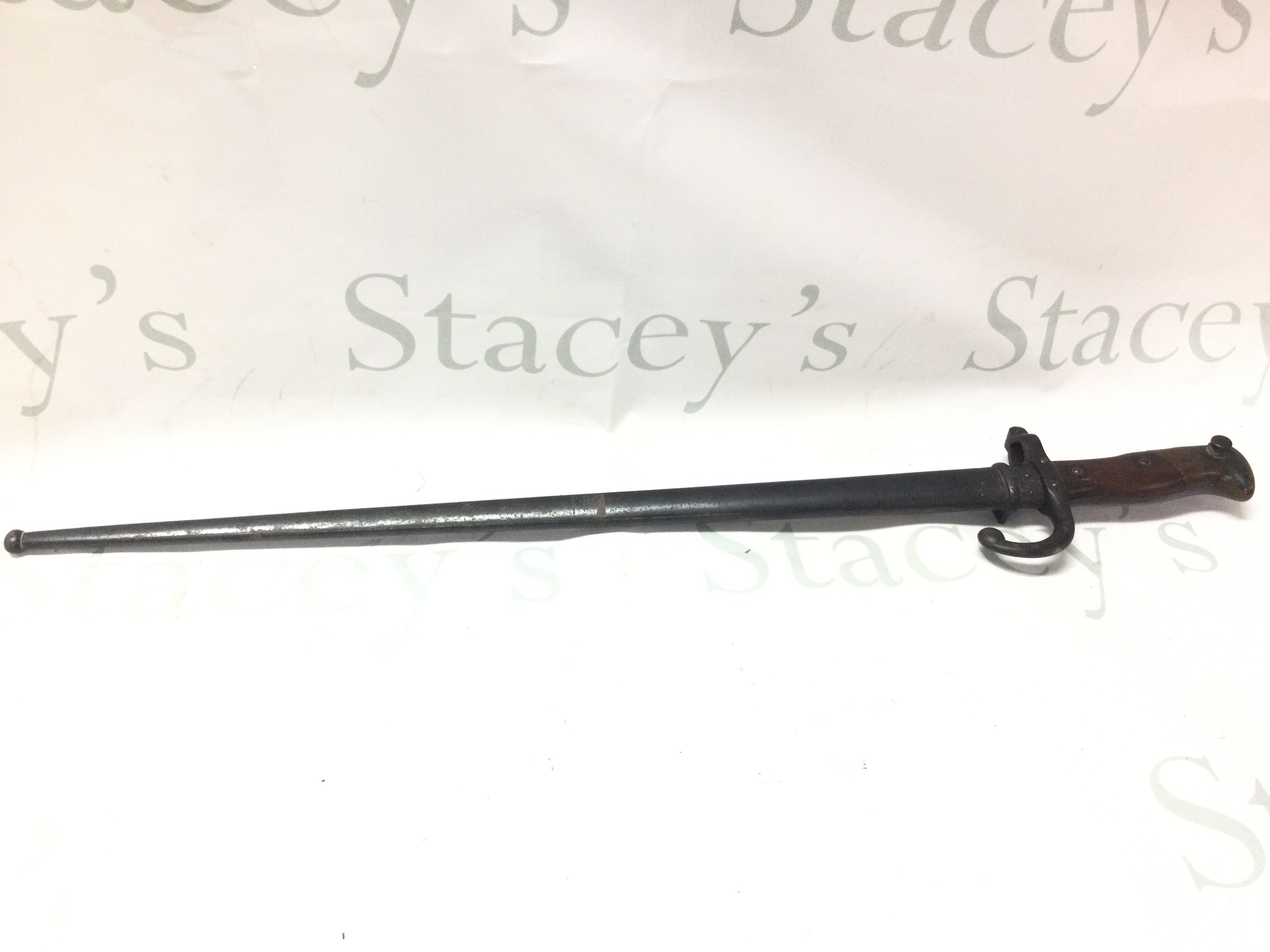 A 19th century French bayonet with matching serial number scabbard , blade marked 1879. 65cm total length approximately. Blade 52cm .This lot cannot be posted