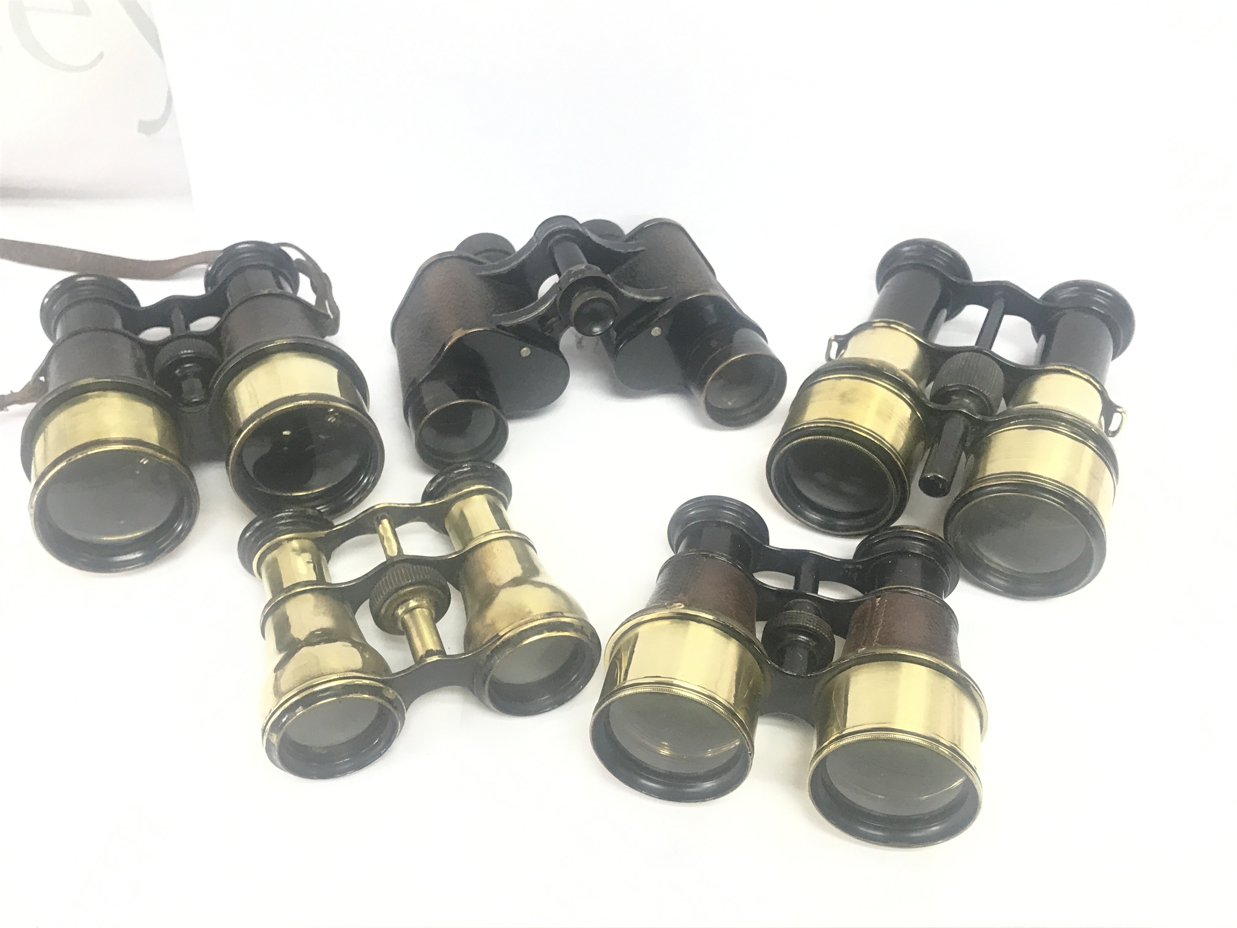 4 Vintage brass binoculars and a pair of military binoculars