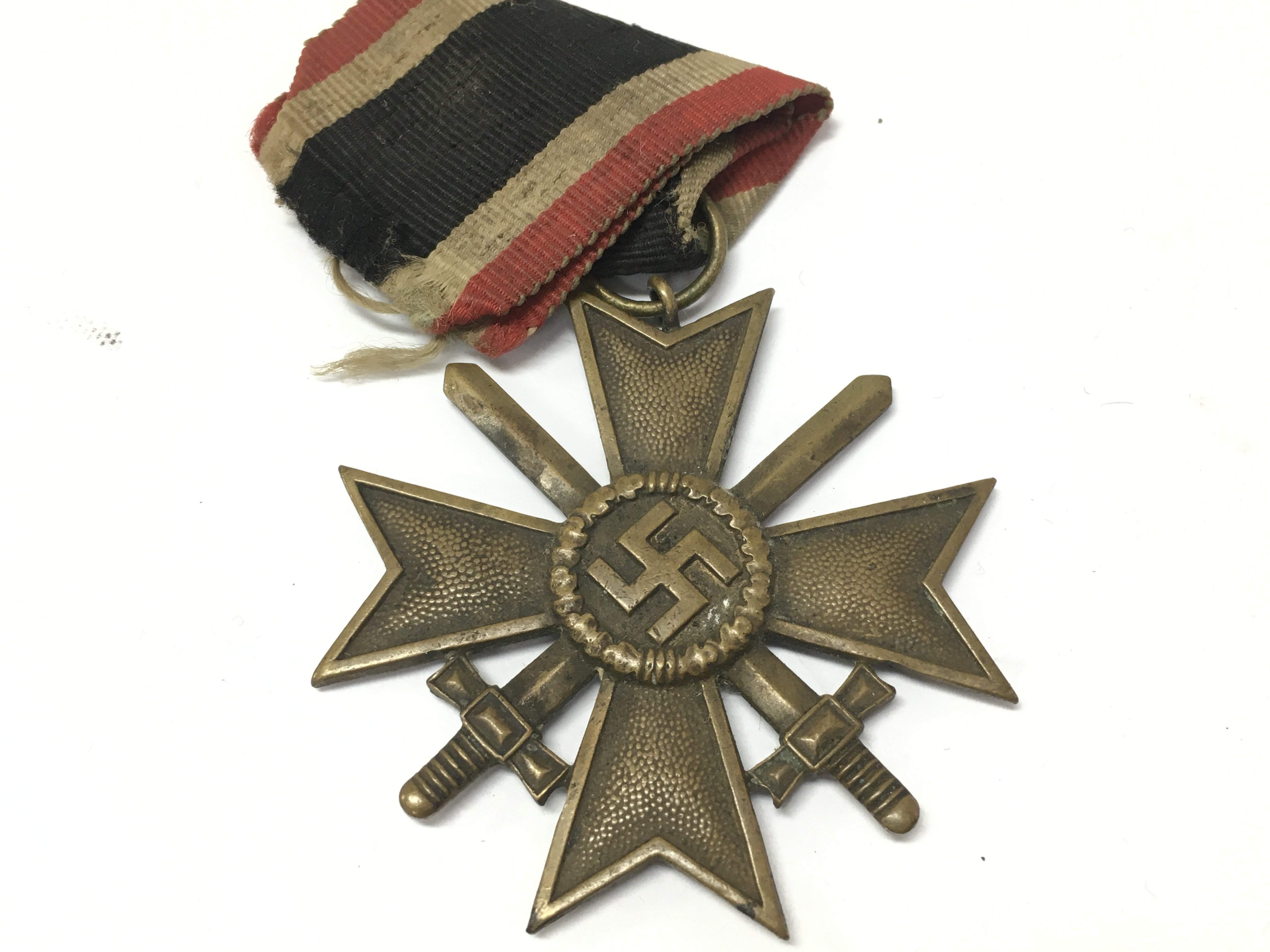 A German Third Reich war merit cross, 1939 and a collection of shield badges including Narvik 1940. postage category A